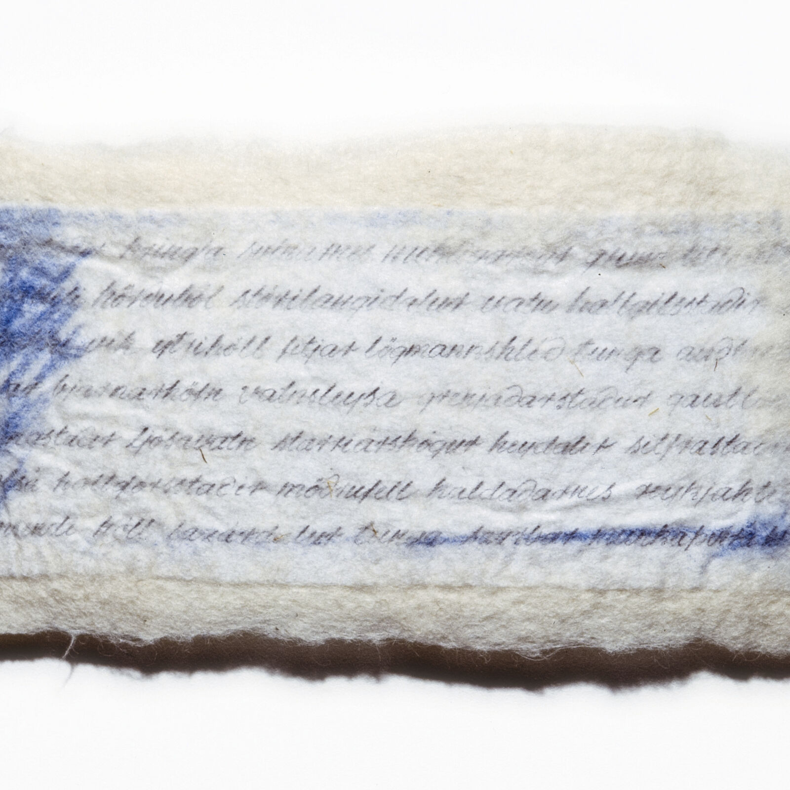 A piece of paper with writing on it sitting on a shelf.
