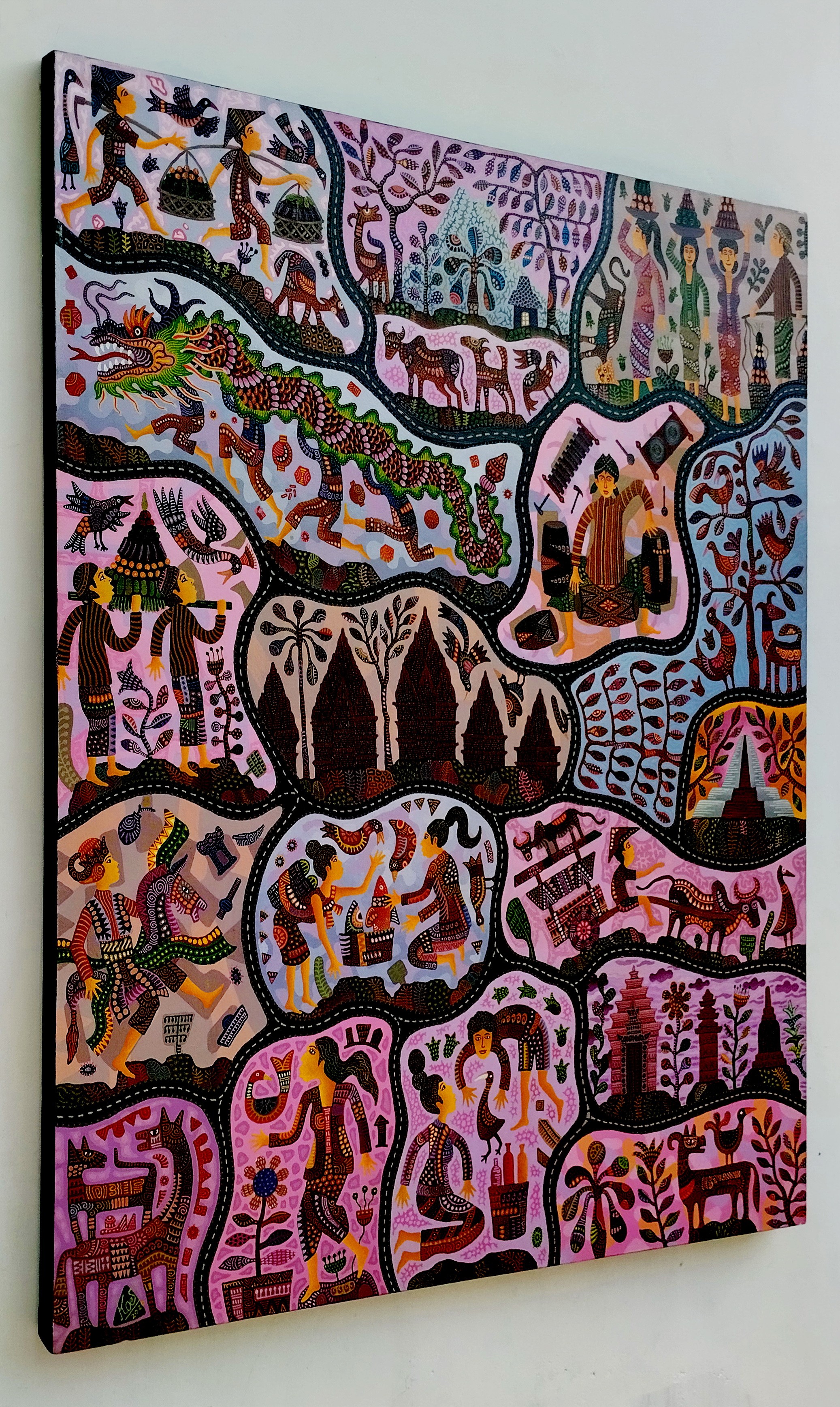 A painting on a wall in a room with a white wall.