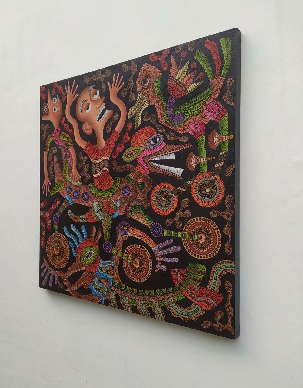 A vibrant, dot-painted artwork featuring a central figure surrounded by mythical creatures and abstract symbols.