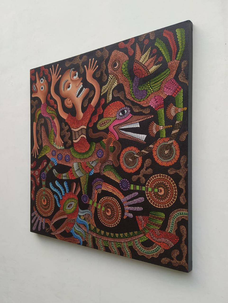 A vibrant, dot-painted artwork featuring a central figure surrounded by mythical creatures and abstract symbols.