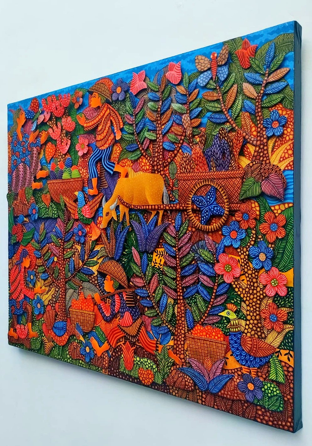 A vibrant, textured tapestry depicting a lush, stylized forest scene filled with figures and animals.