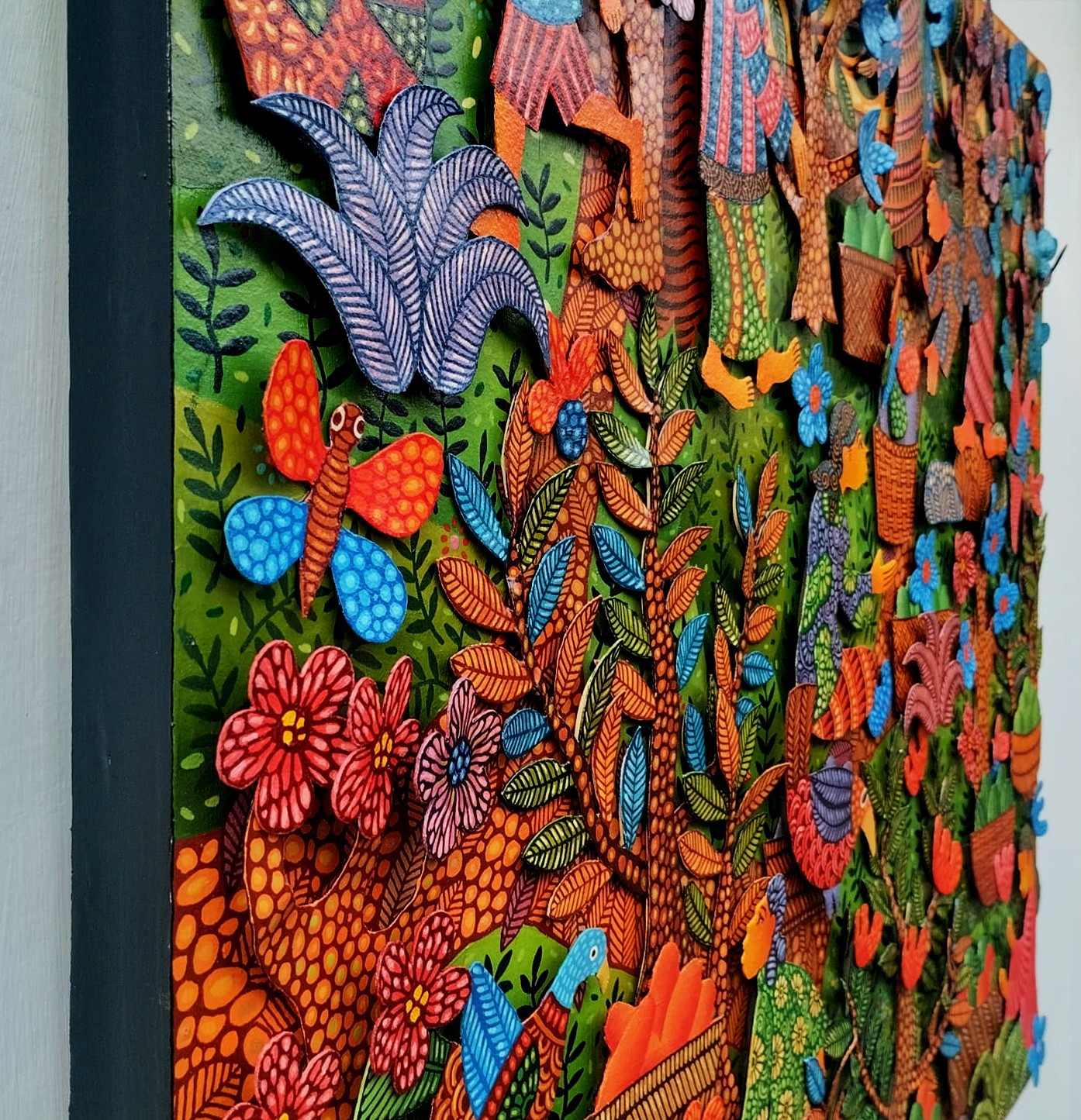 A colorful painting on a wall in a room.