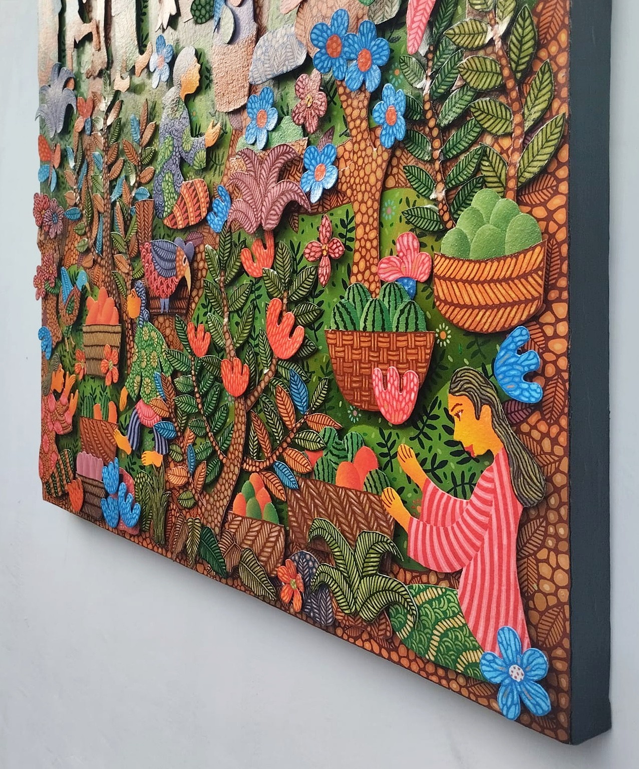 A colorful painting on a wall in a room.
