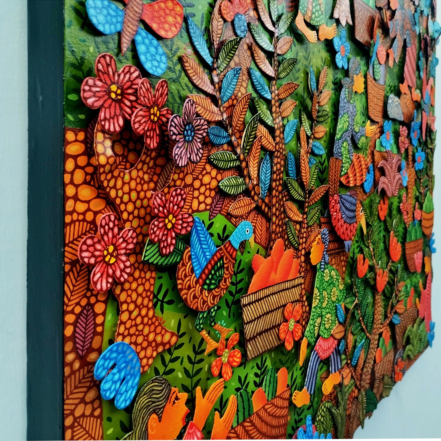A colorful painting on a wall in a room.