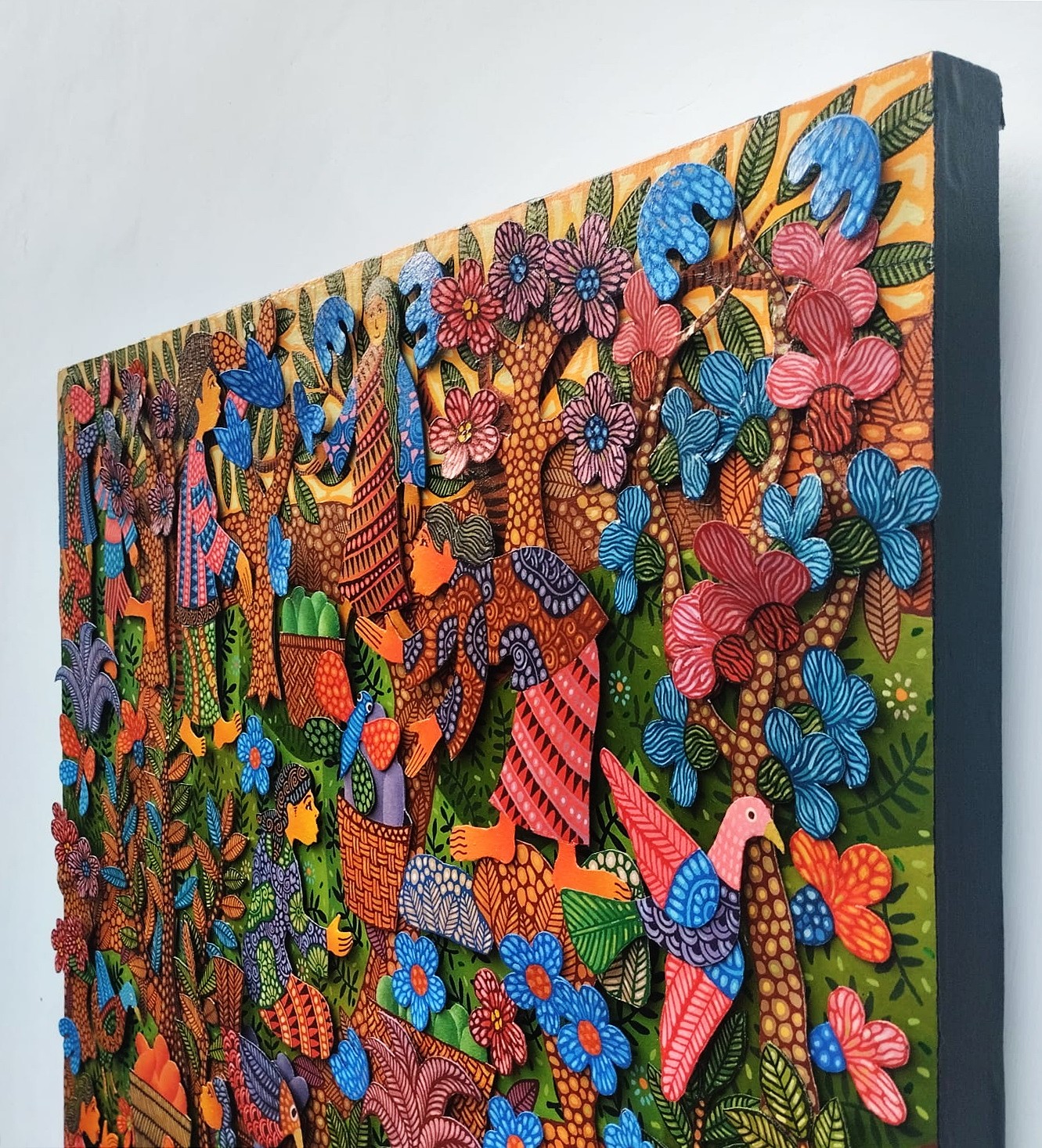 A colorful painting on a wall in a room.