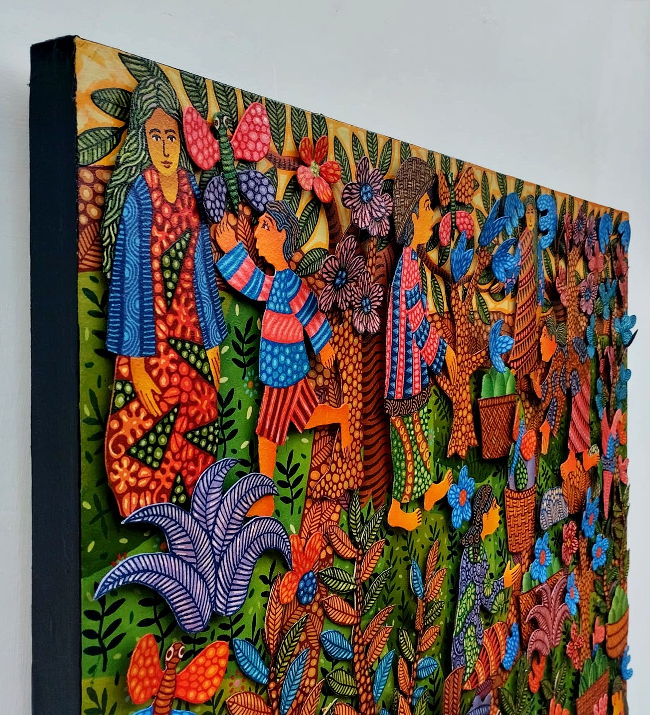 A colorful painting on a wall in a room.