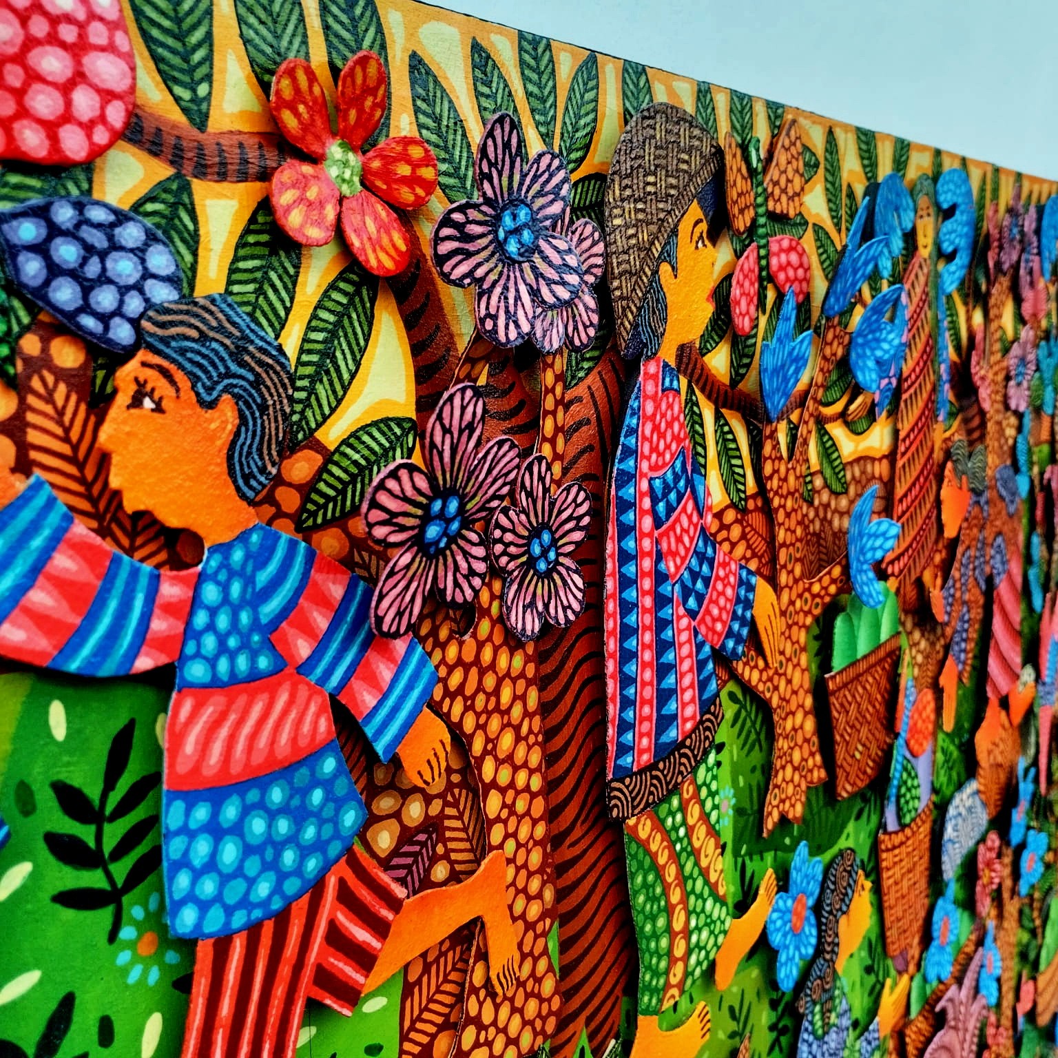A colorful painting on a wall in a room.