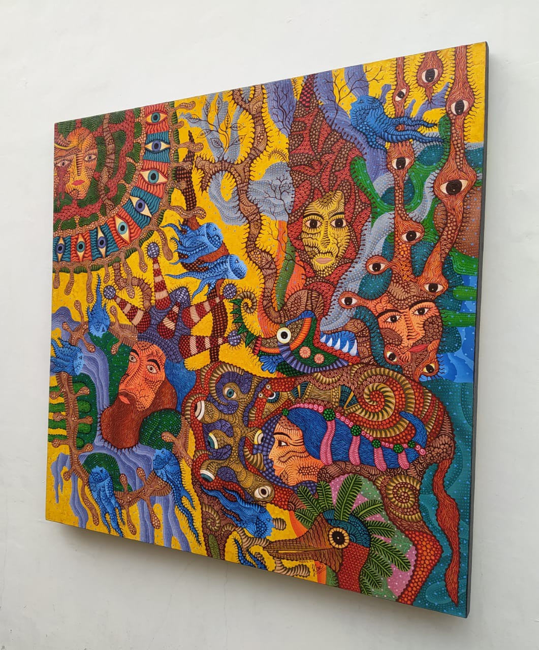 A vibrant, chaotic tapestry of faces and eyes swirling in a dense, colorful composition.