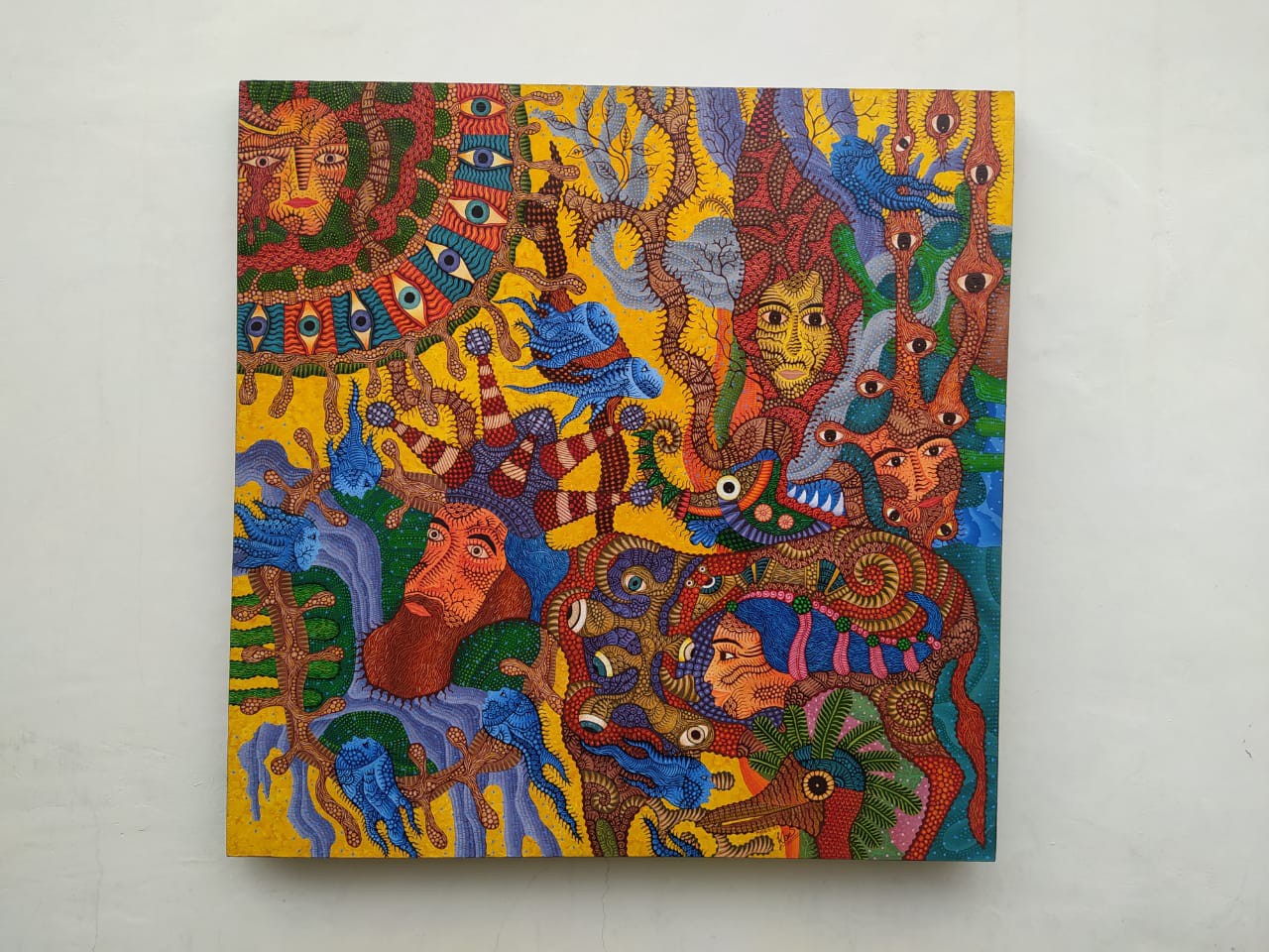 A vibrant, chaotic tapestry of faces and eyes swirling in a dense, colorful composition.