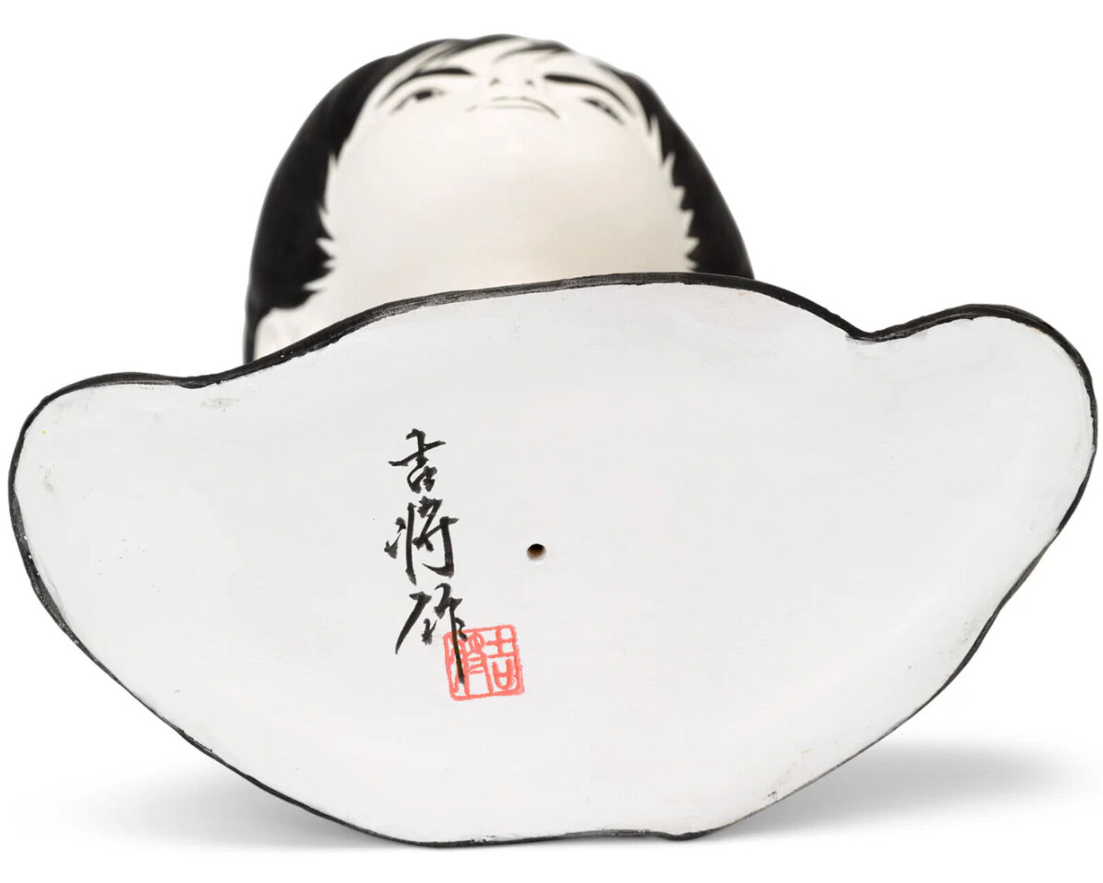 A mannequin head with a black wig on a white background.