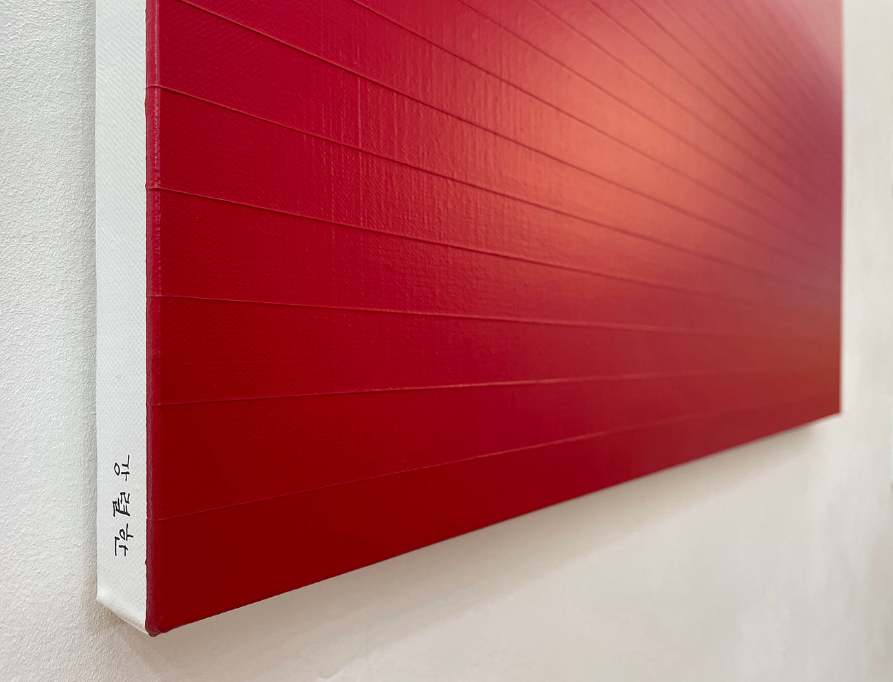 A red and beige ombre background with a white border.