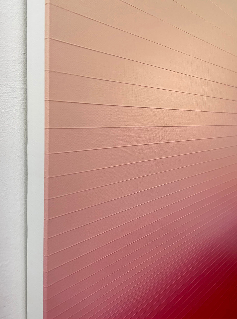 A red and beige ombre background with a white border.