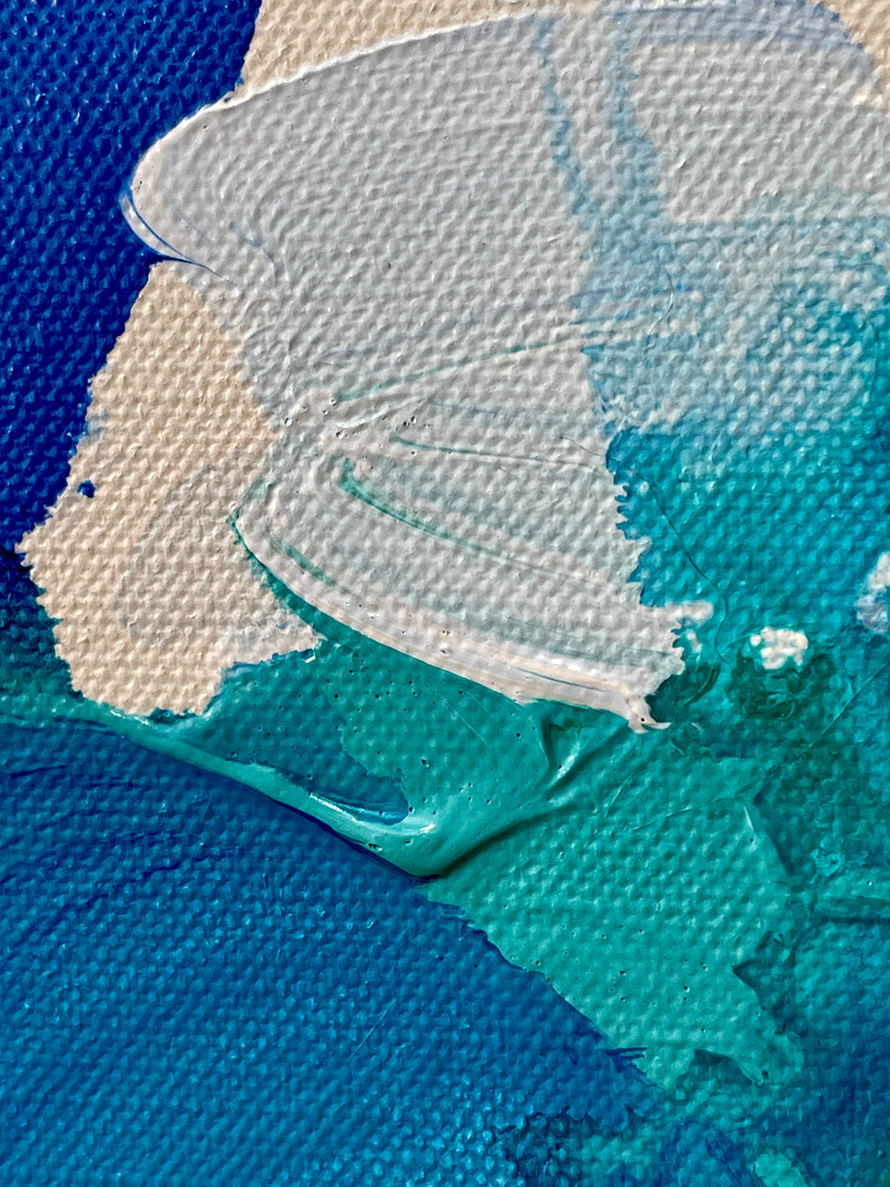 A painting of blue and green paint splatters on a white background.