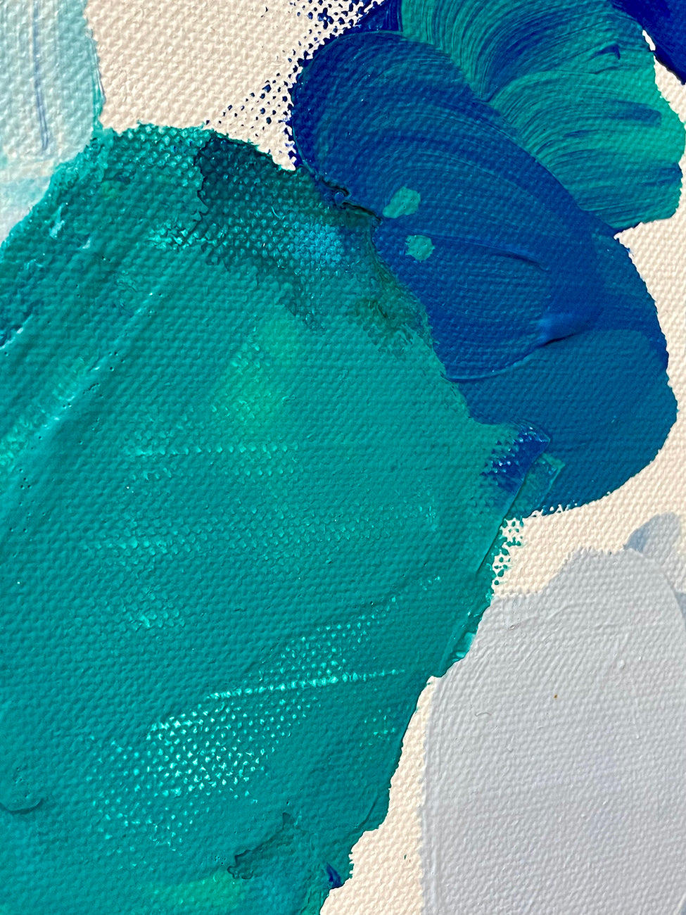 A painting of blue and green paint splatters on a white background.