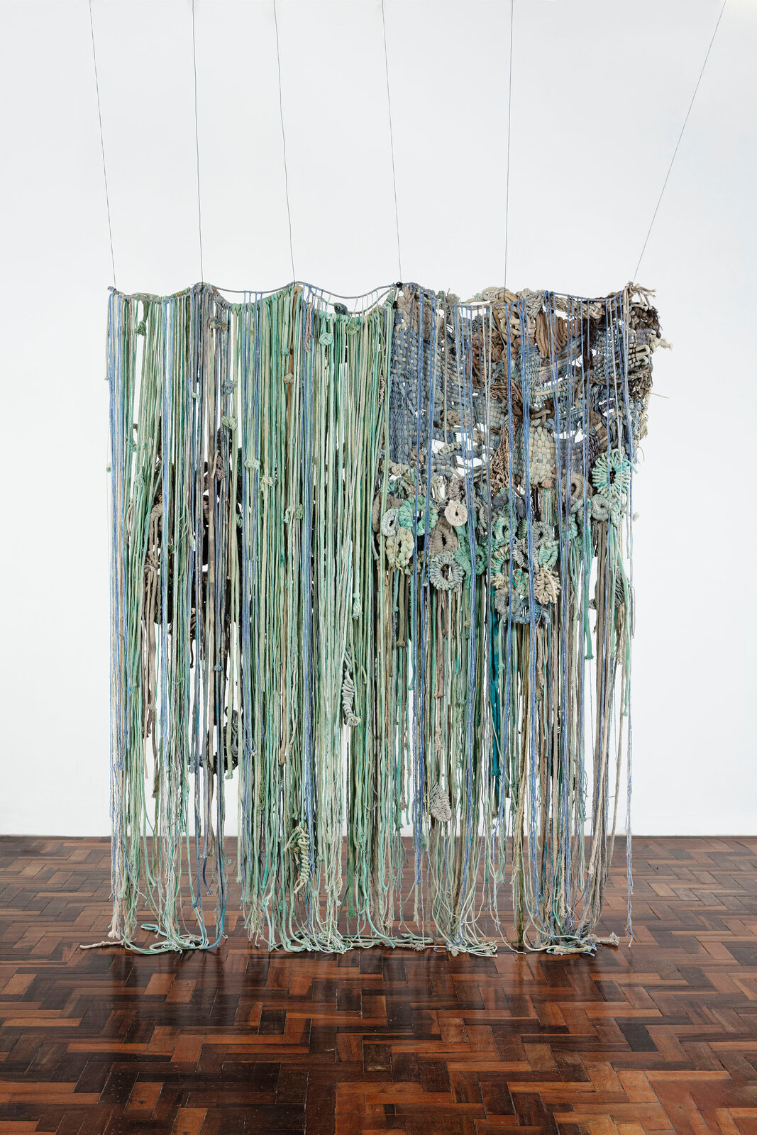 Artwork by Laura Lima, Charía, Made of Raw cotton threads dyed by natural pigments and wire 