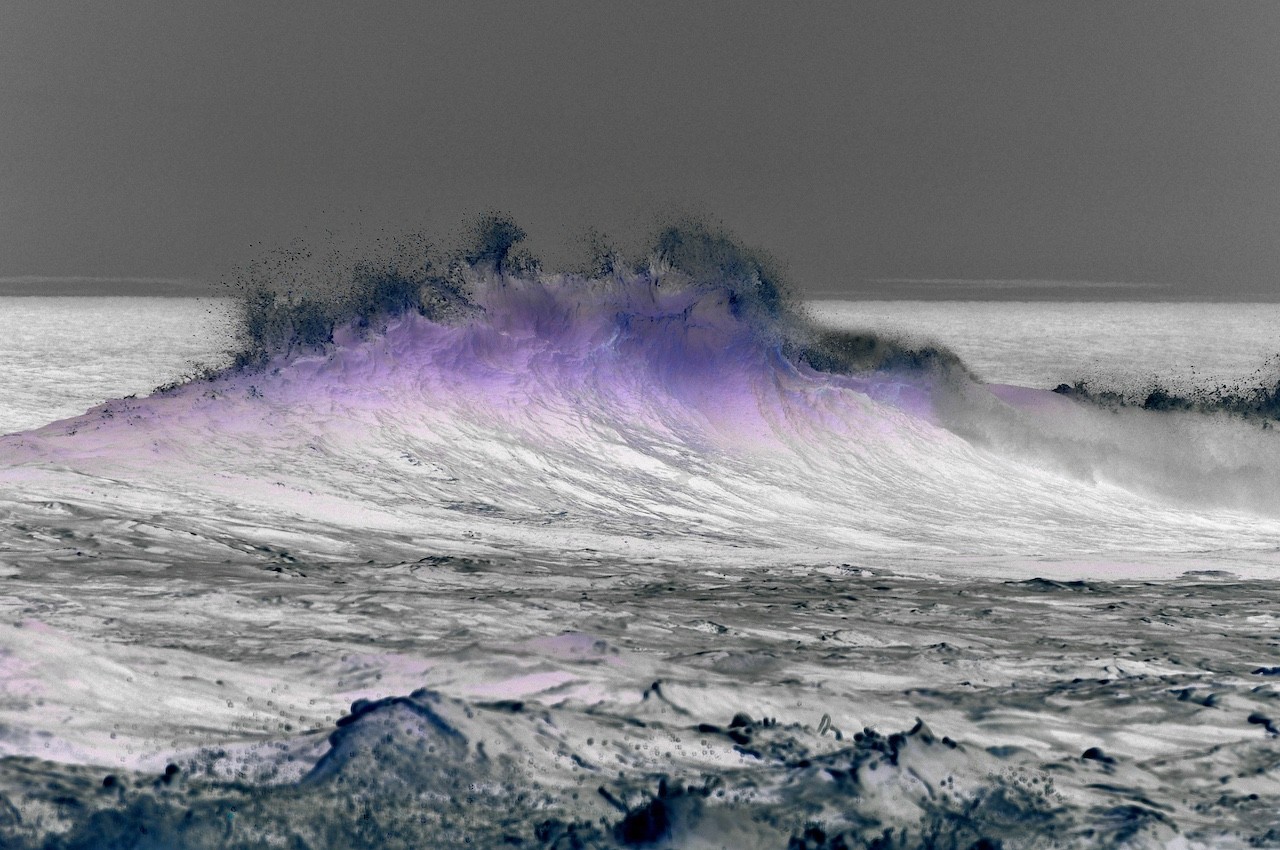 A dramatic ocean wave captured in a stylized, high-contrast monochrome with a striking purple glow.