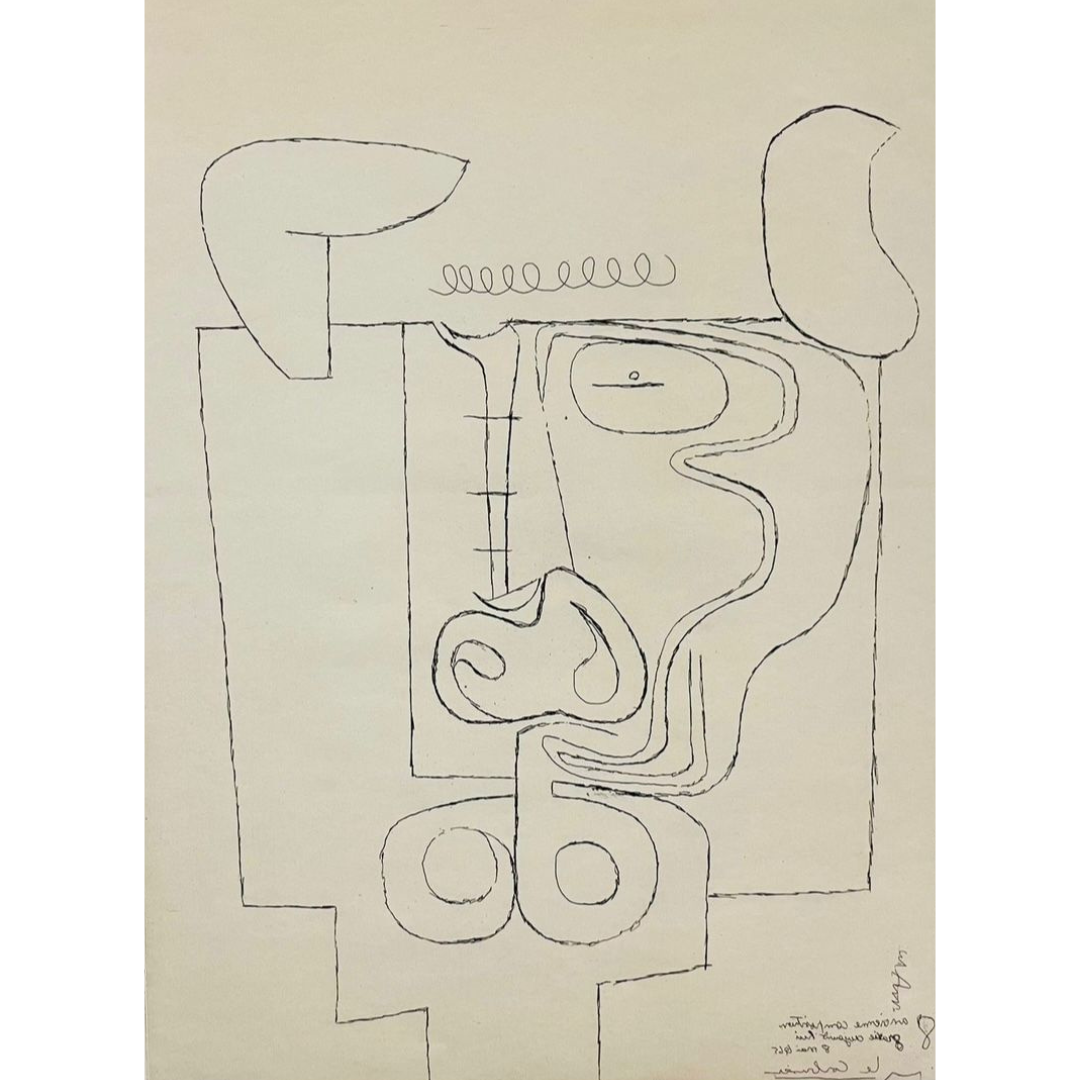 A black and white drawing of a face on a piece of paper.