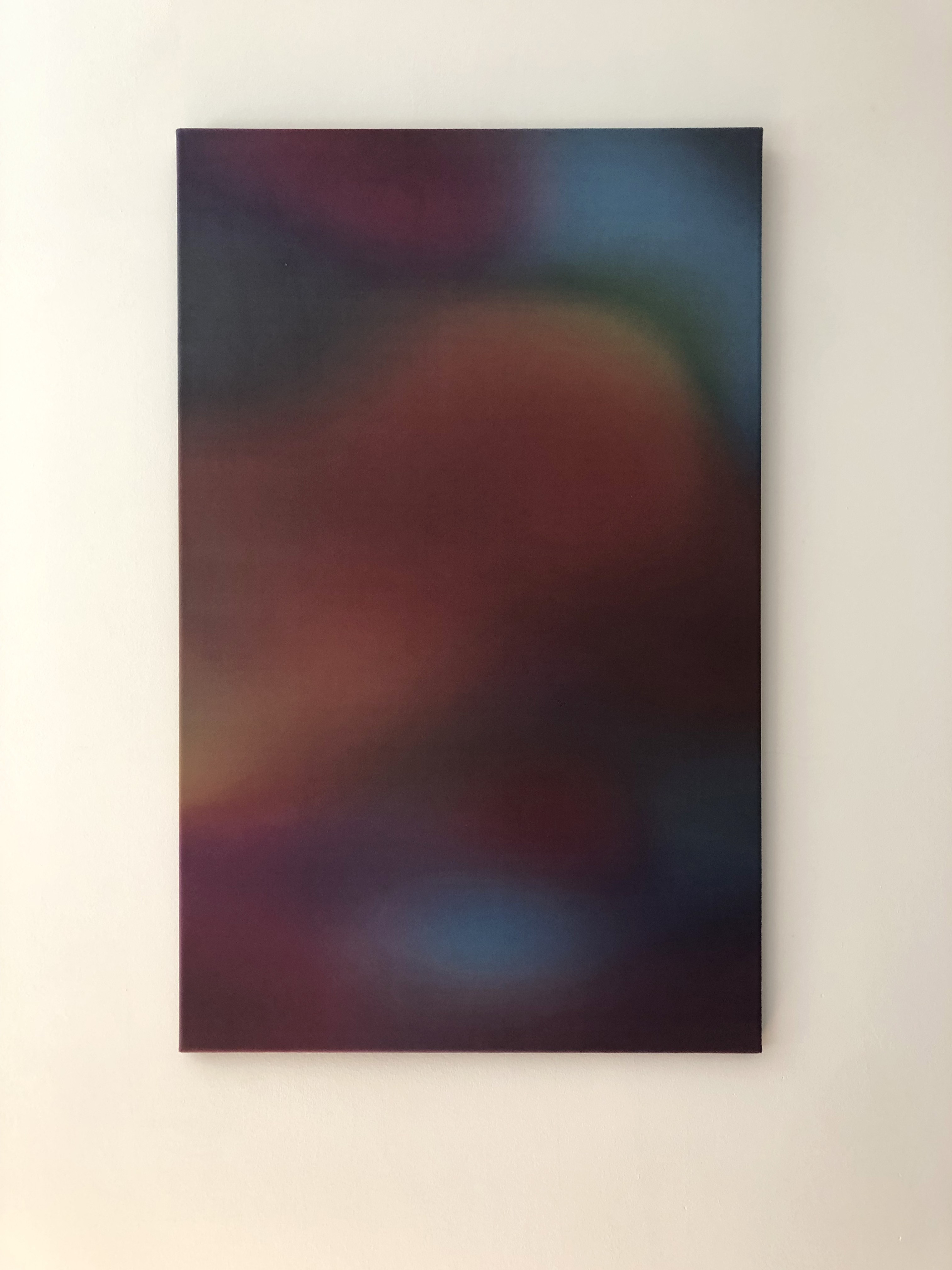 A vertical abstract composition featuring blurred, warm-toned shapes against a dark background.