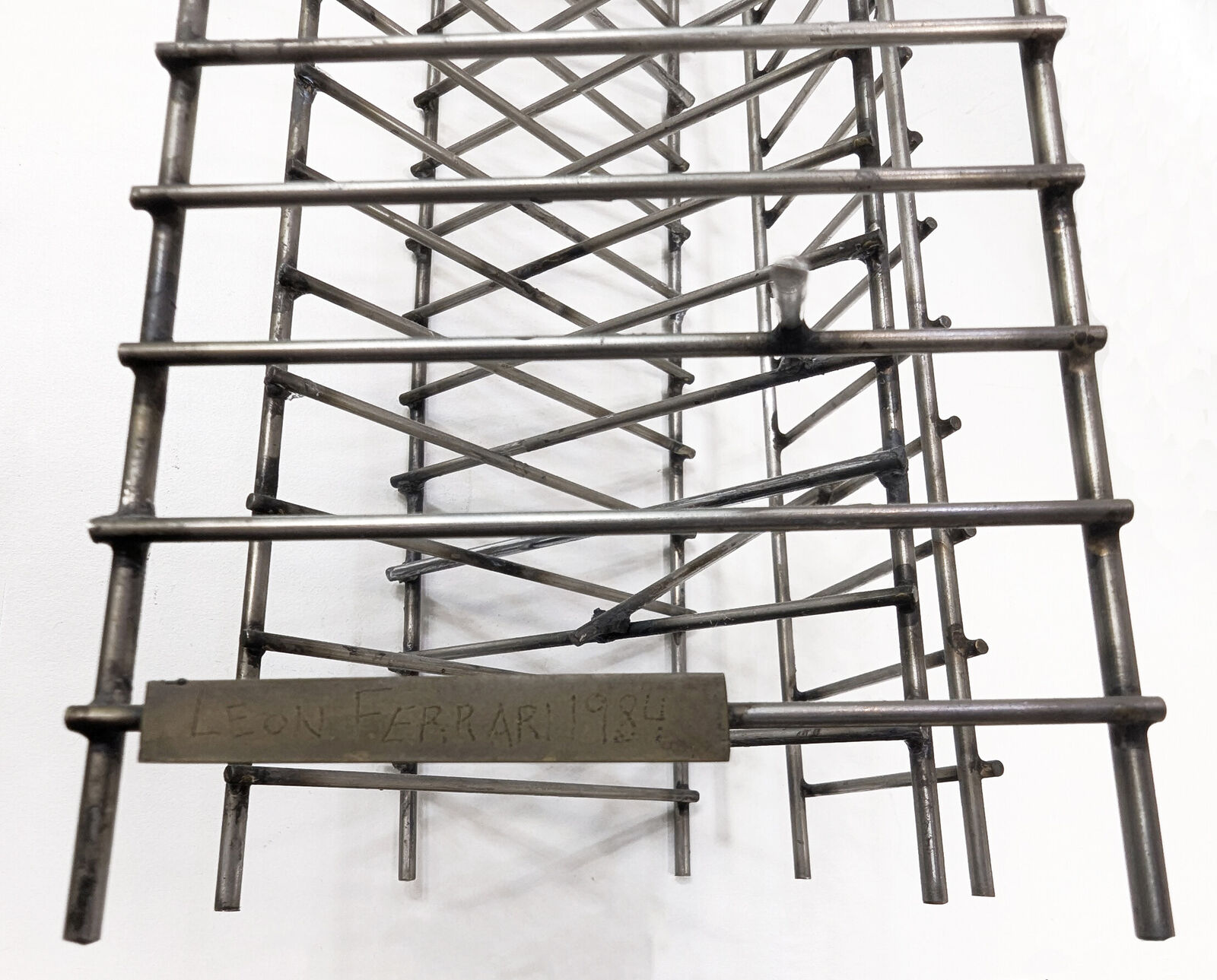 A black and white photo of a tall metal structure.