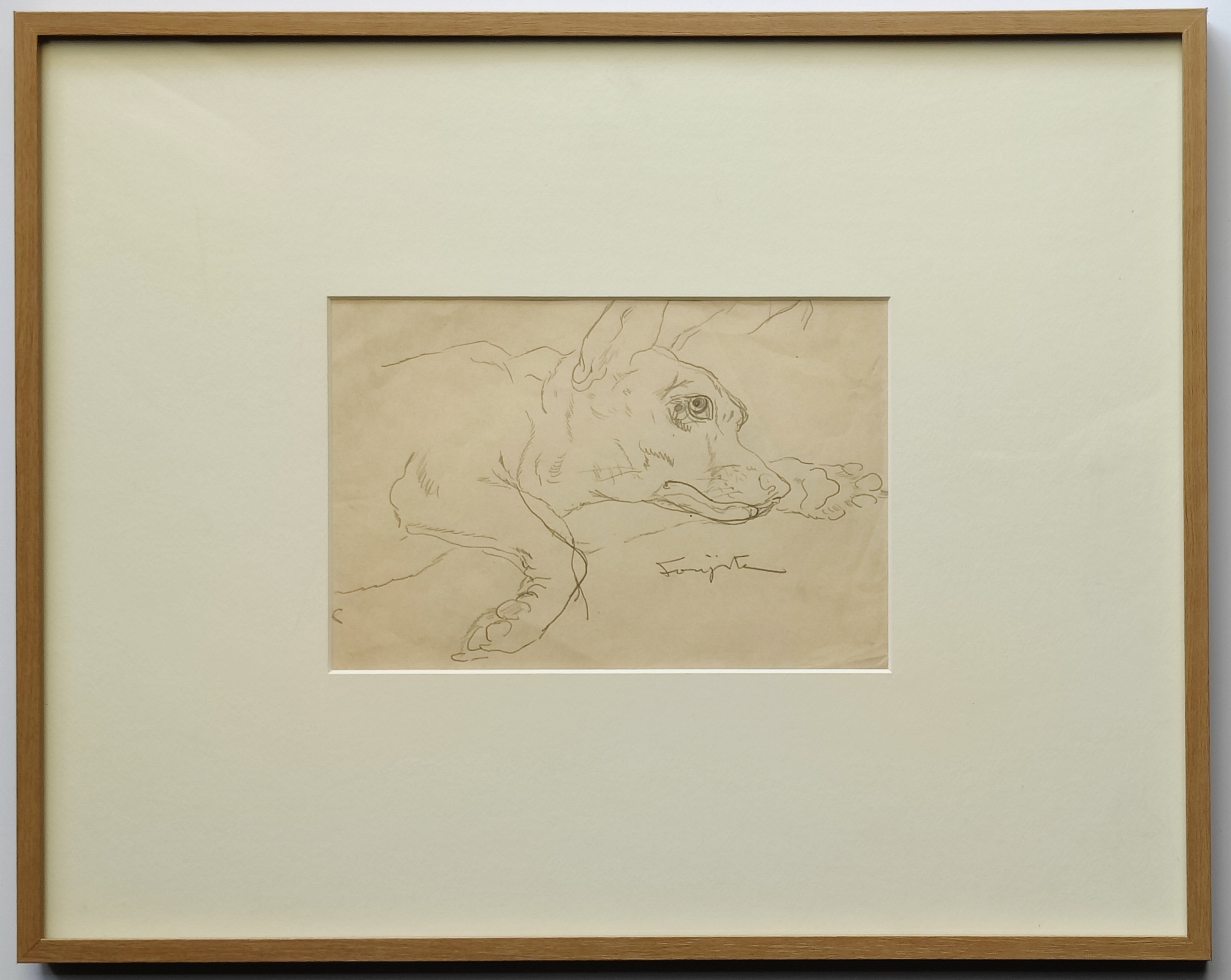 A drawing of a dog laying down on the ground.