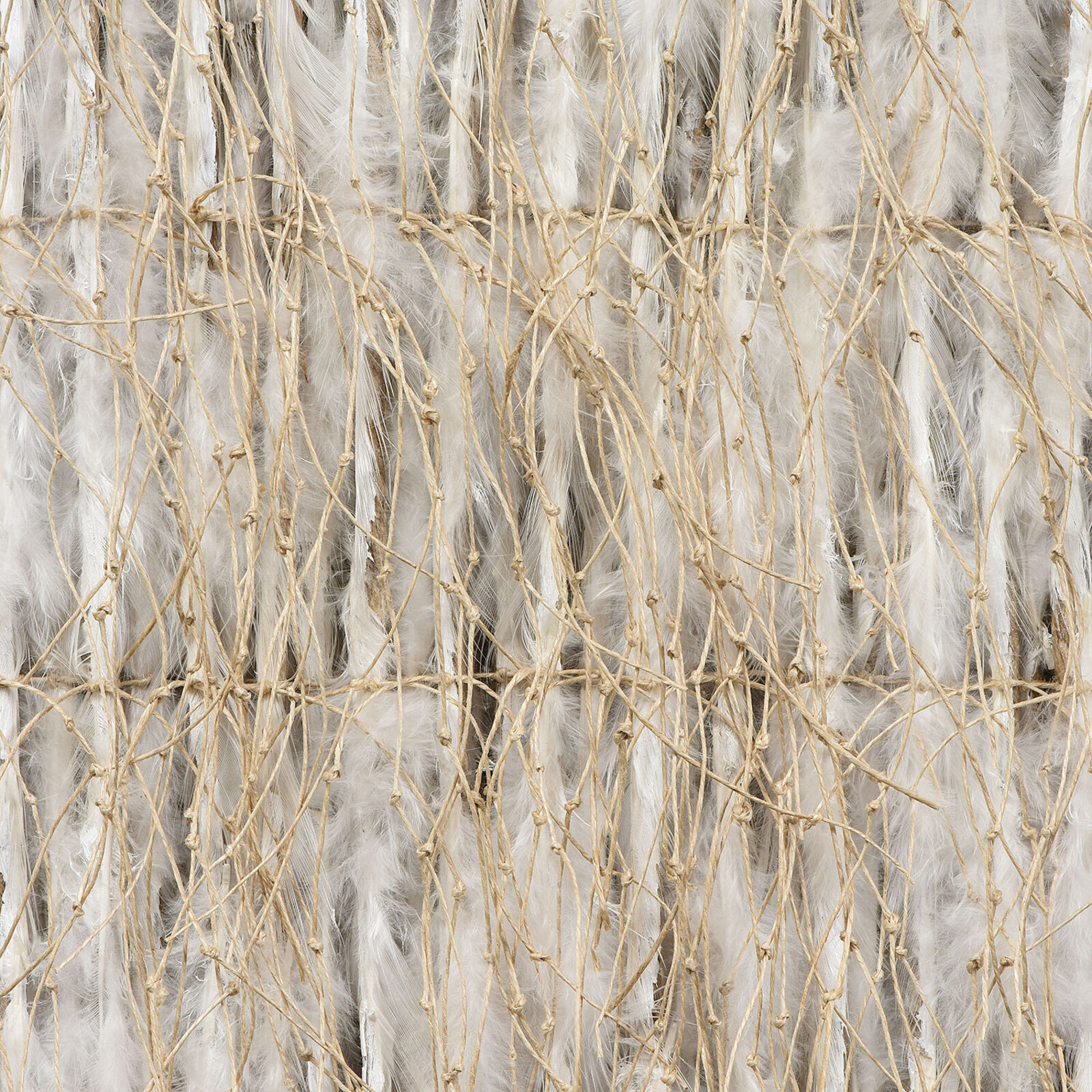 A piece of woven fabric on a white wall.