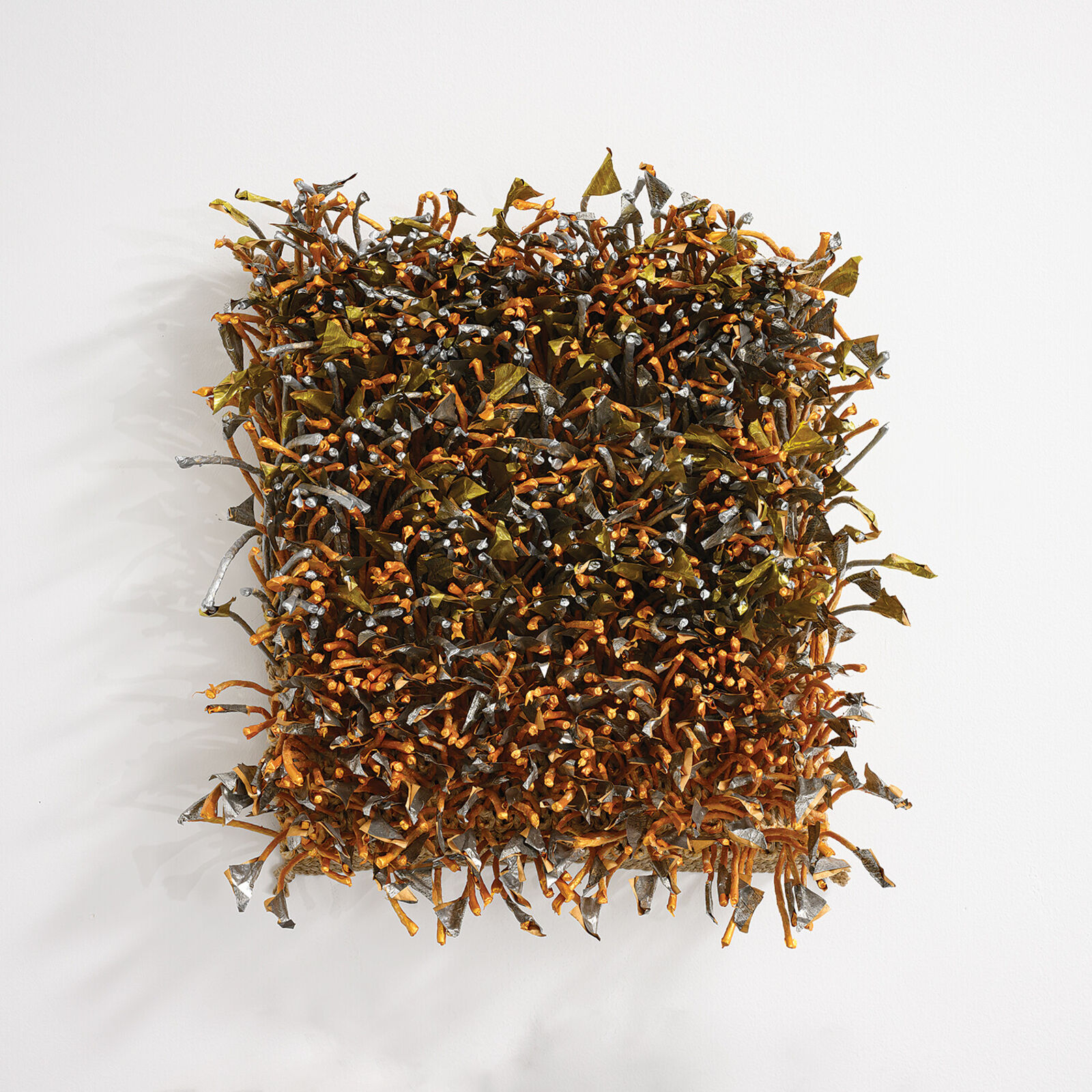 A pile of seaweed on a white surface. 