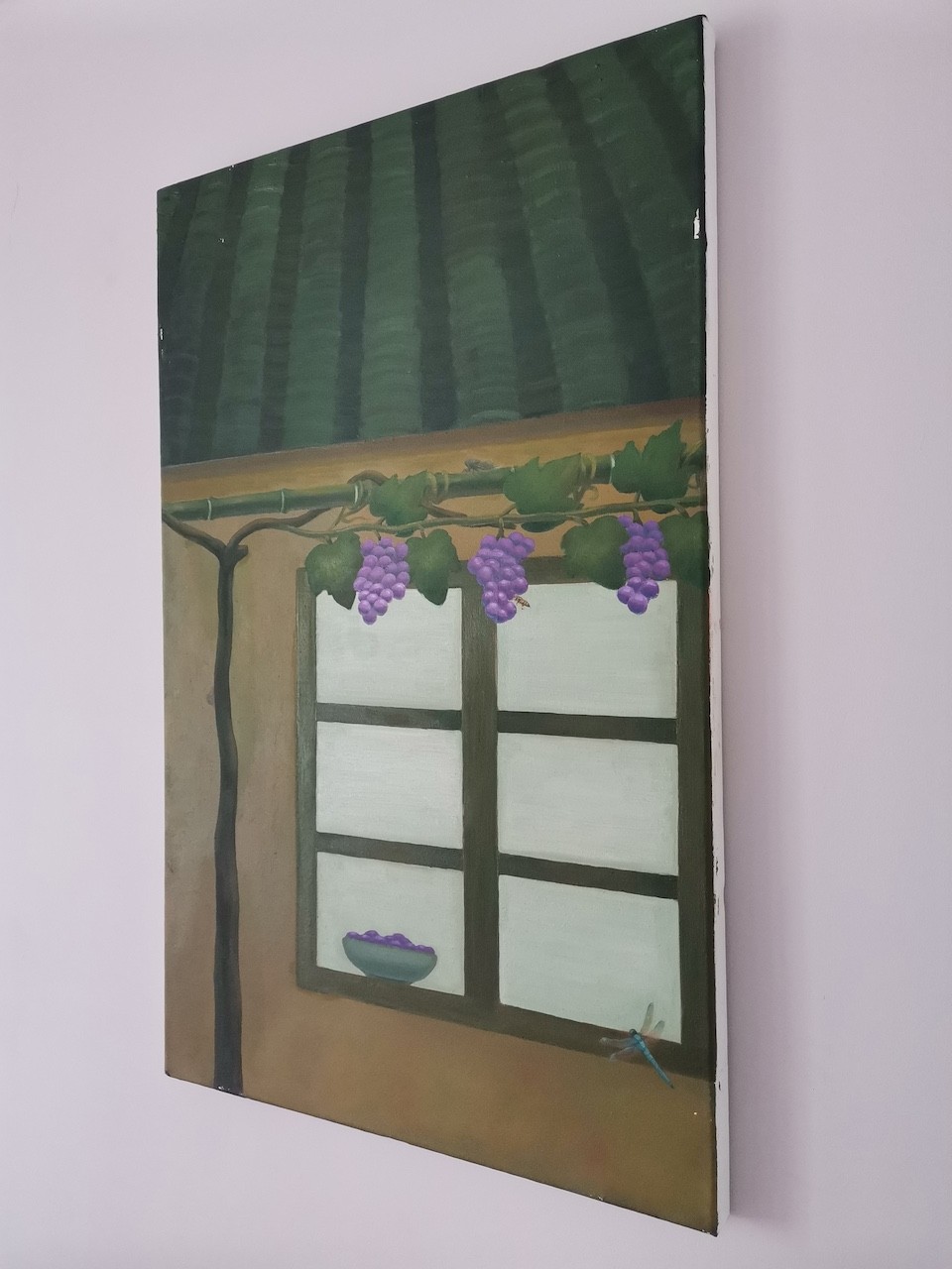 A still life painting of a window with hanging purple grapes and a dragonfly.