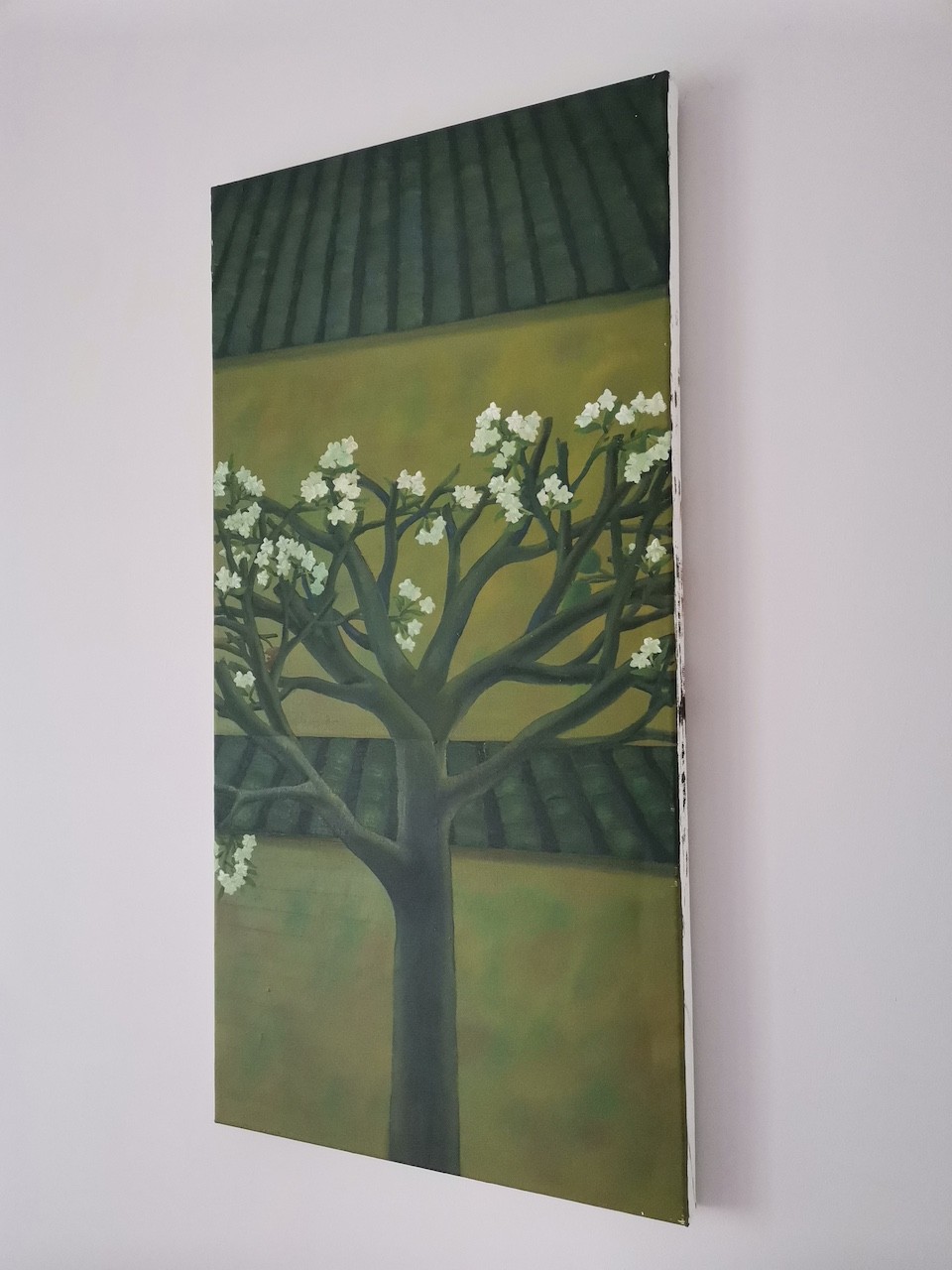 A vertical painting of a blossoming tree against a layered background of green and yellow tones.