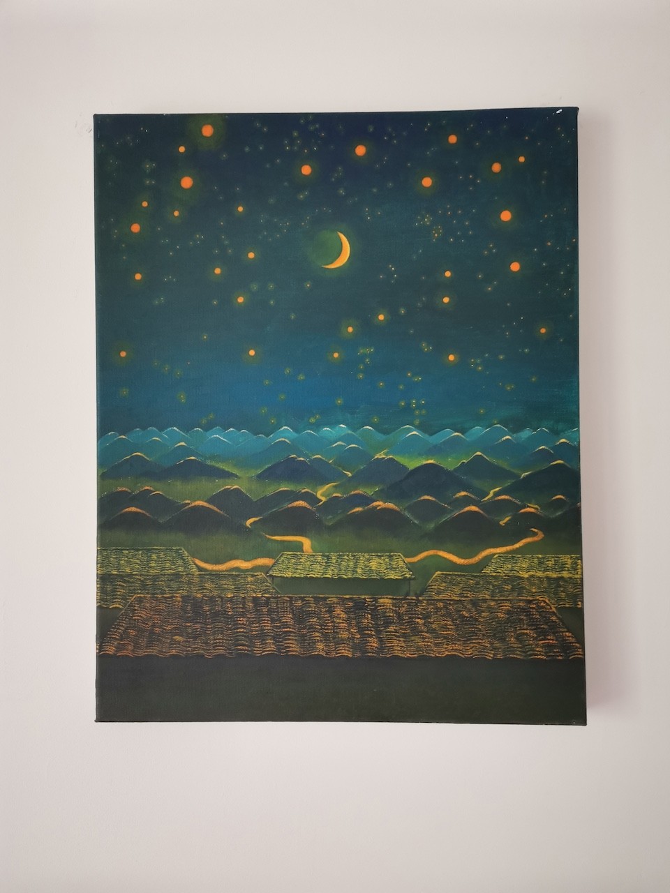 A painting hanging on a wall in a room.