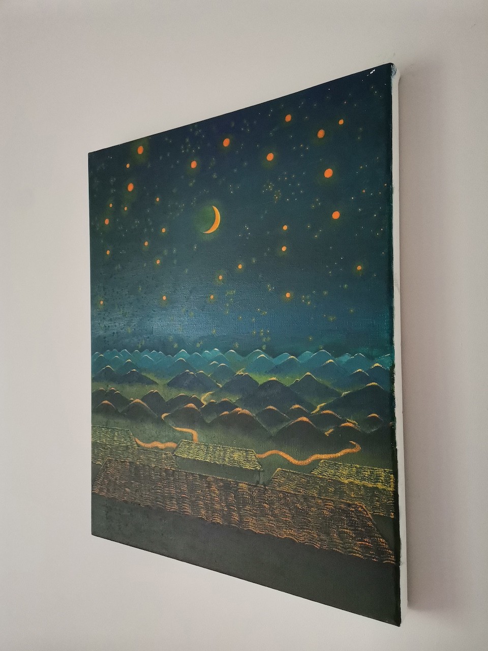 A painting hanging on a wall in a room.