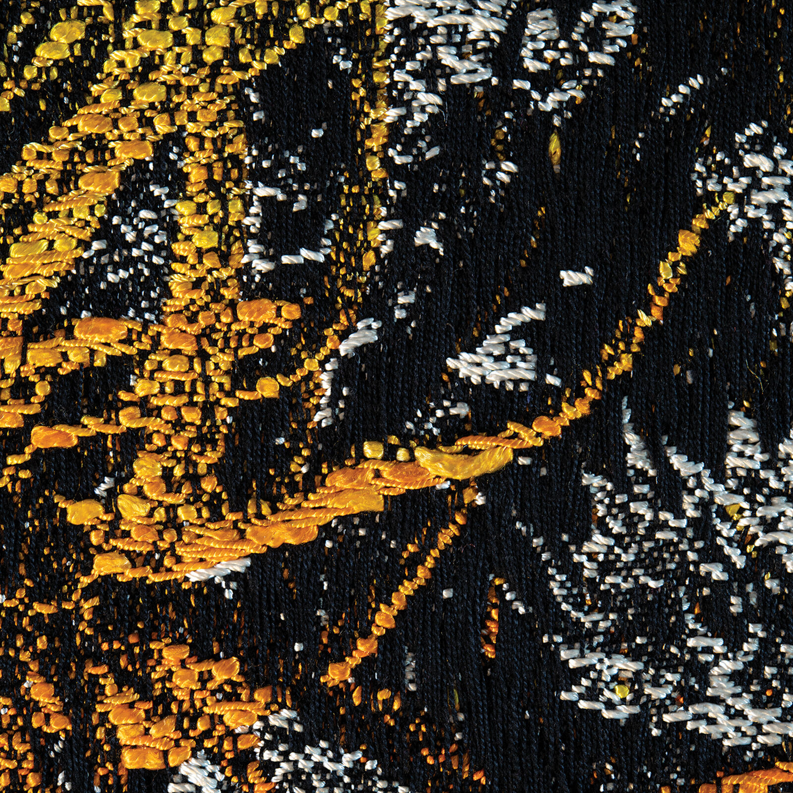 A framed textile artwork featuring a dense, textured forest scene with vibrant green ferns and yellow foliage against a dark background.