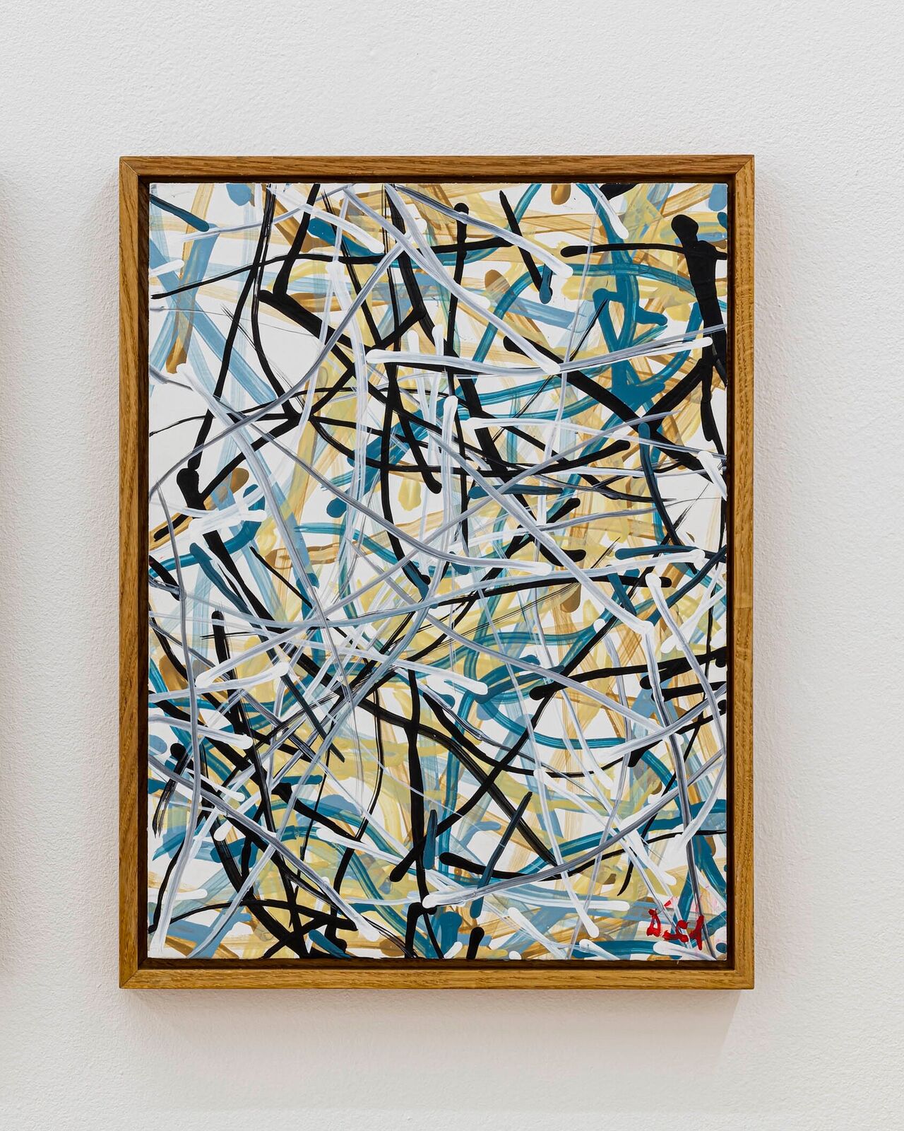 A dynamic abstract painting featuring a chaotic web of intersecting lines in blue, black, white, and yellow.