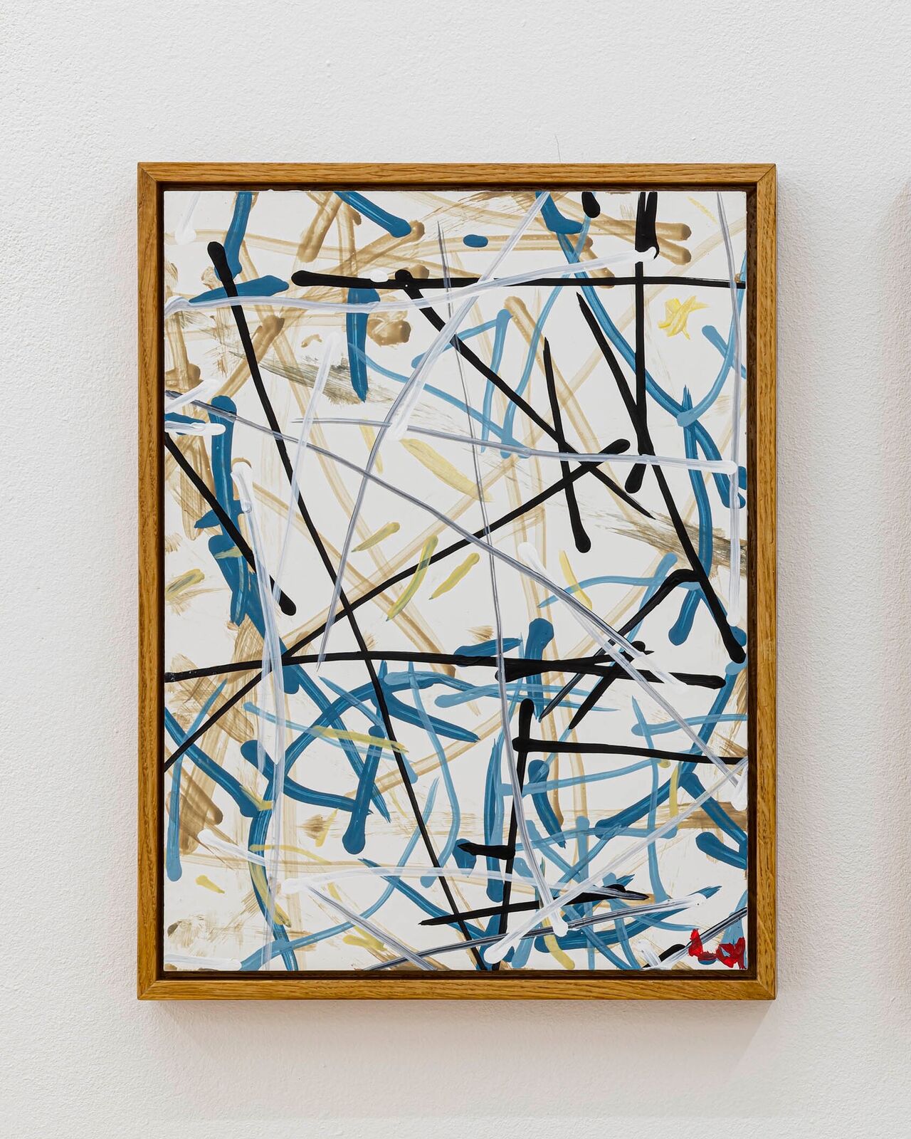 An abstract painting featuring a chaotic web of intersecting lines and strokes in blue, black, white, and gold.