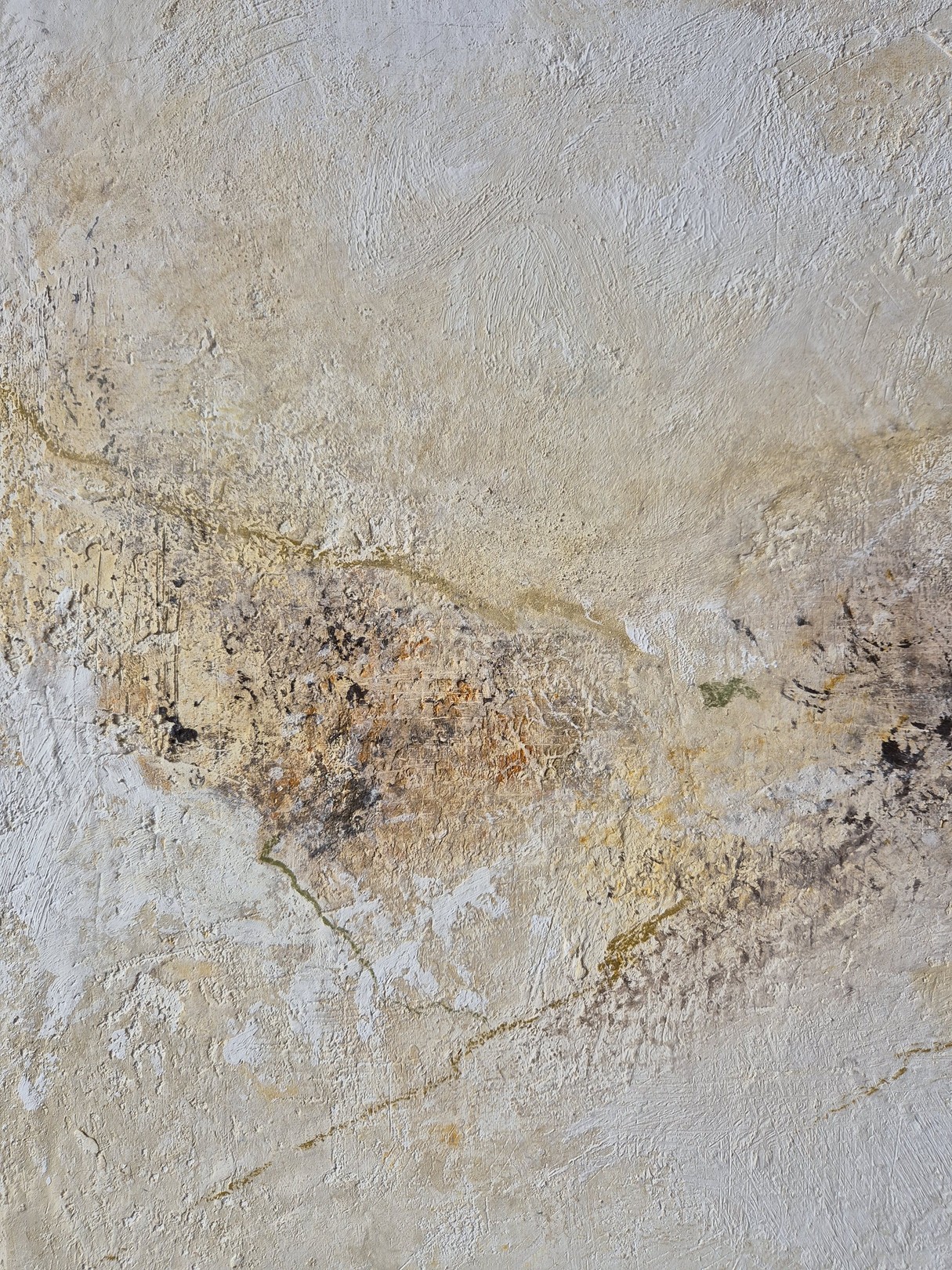 An abstract textured surface with layered, weathered tones.