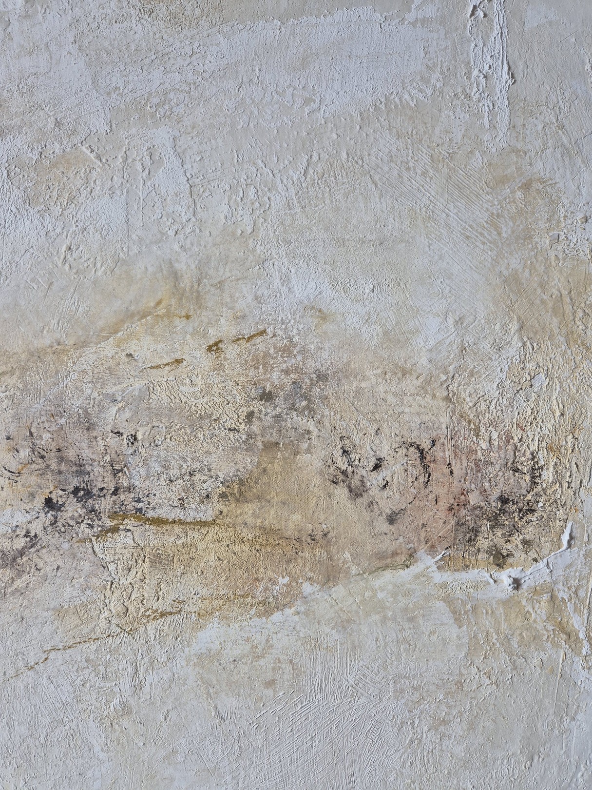 An abstract textured surface with layered, weathered tones.