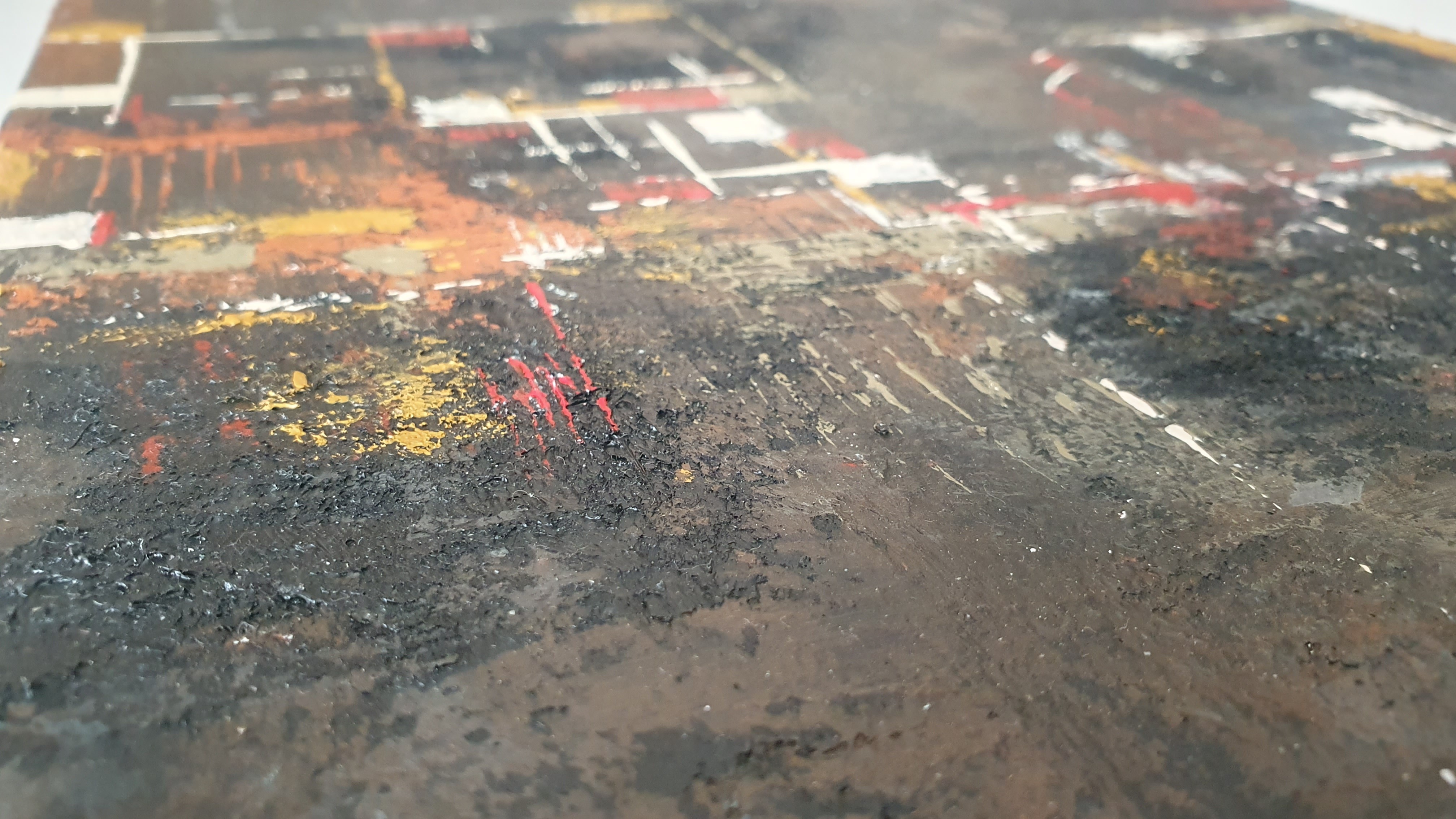 A close up of a painting on a table.