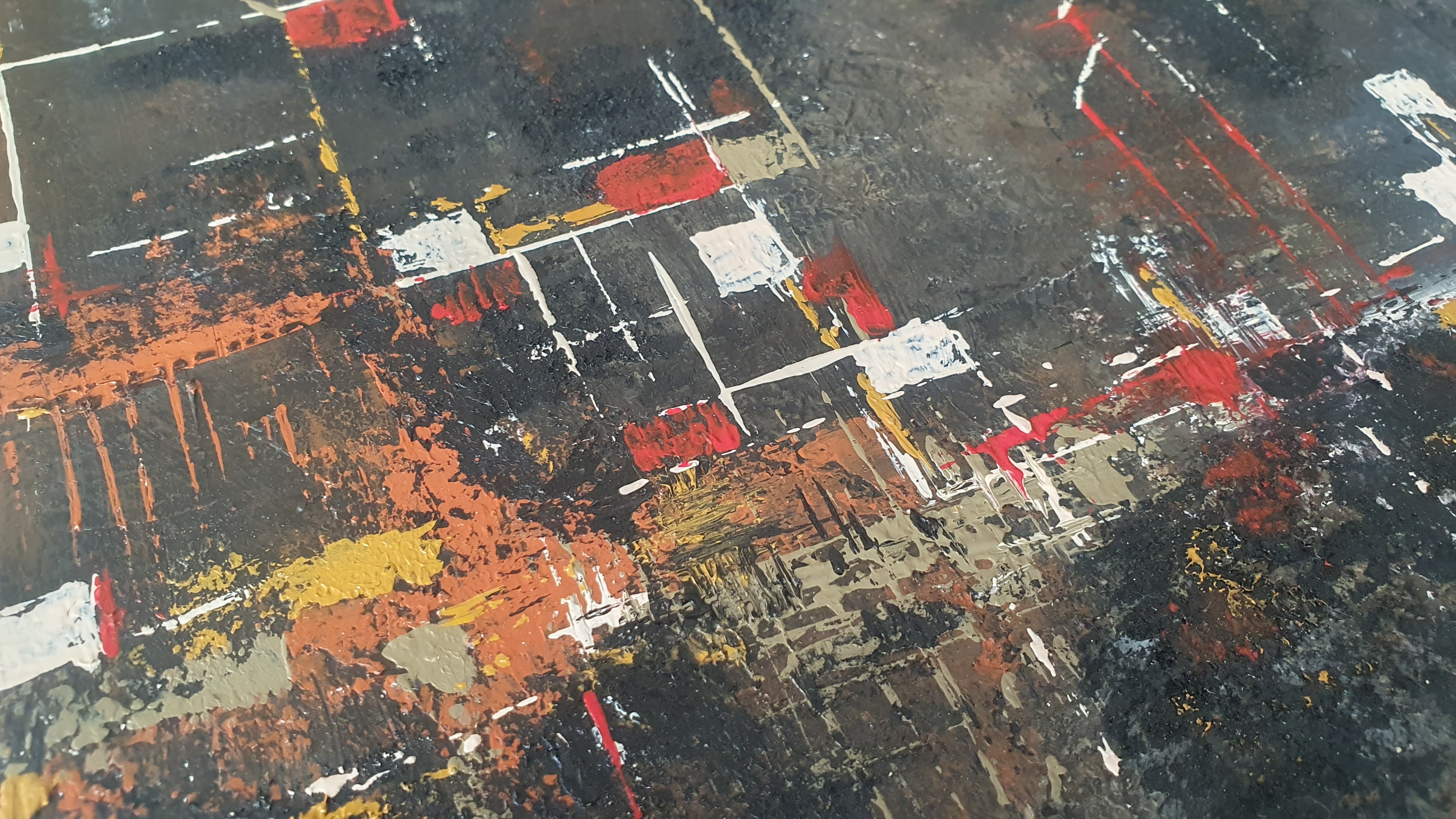 A close up of a painting on a table.