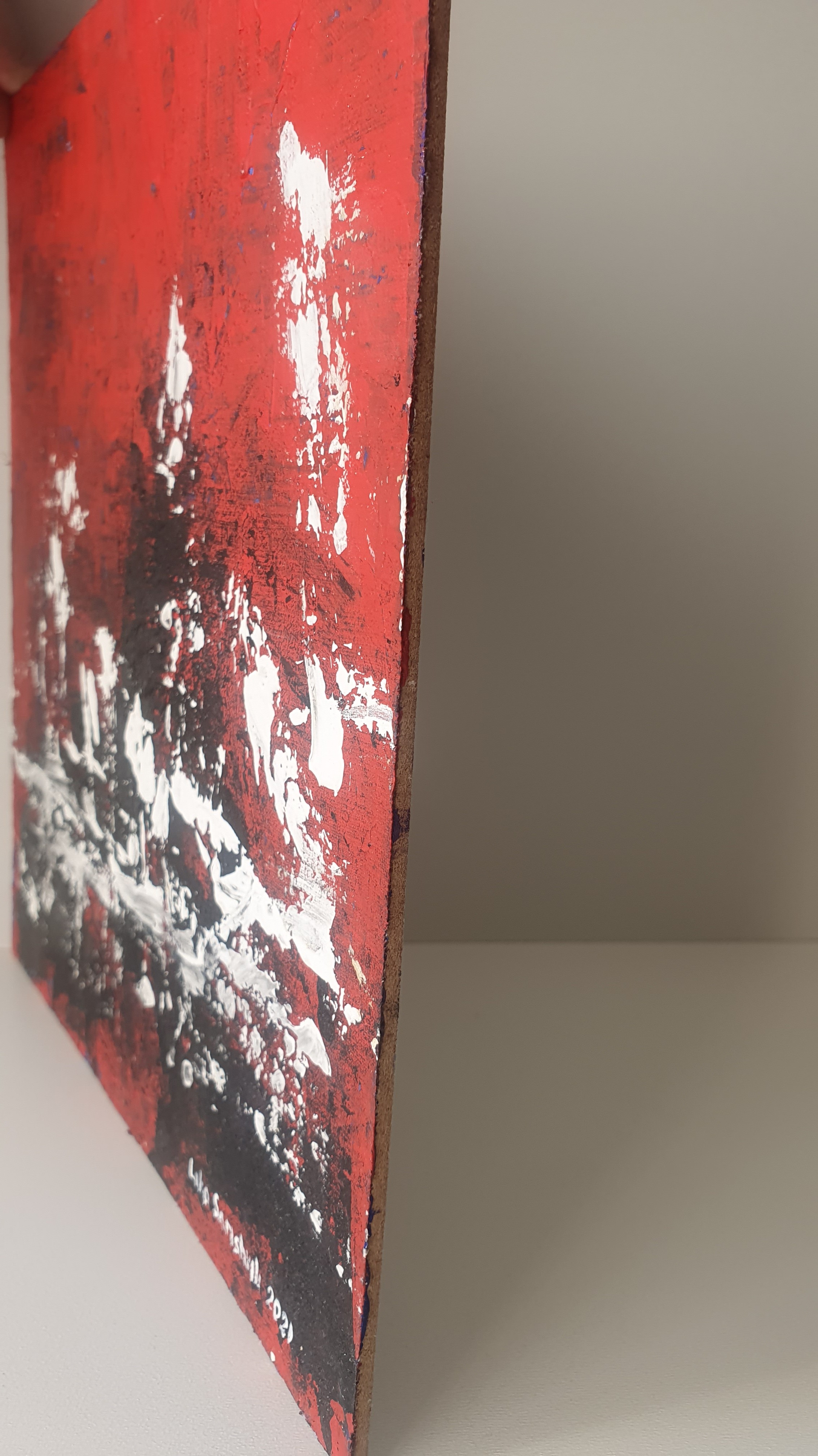 A painting of a red and black abstract painting.