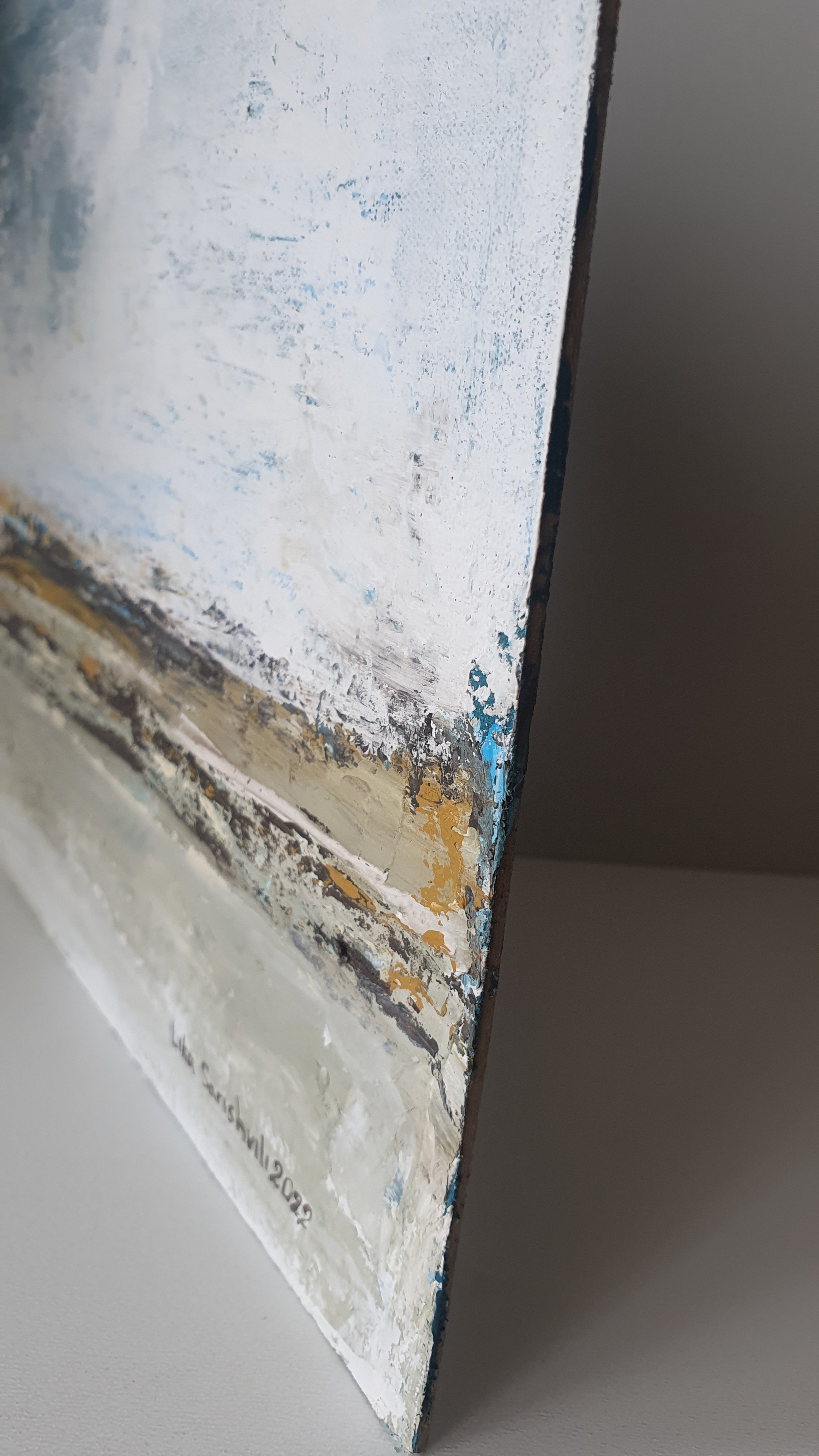 A close up of a painting on a wall.