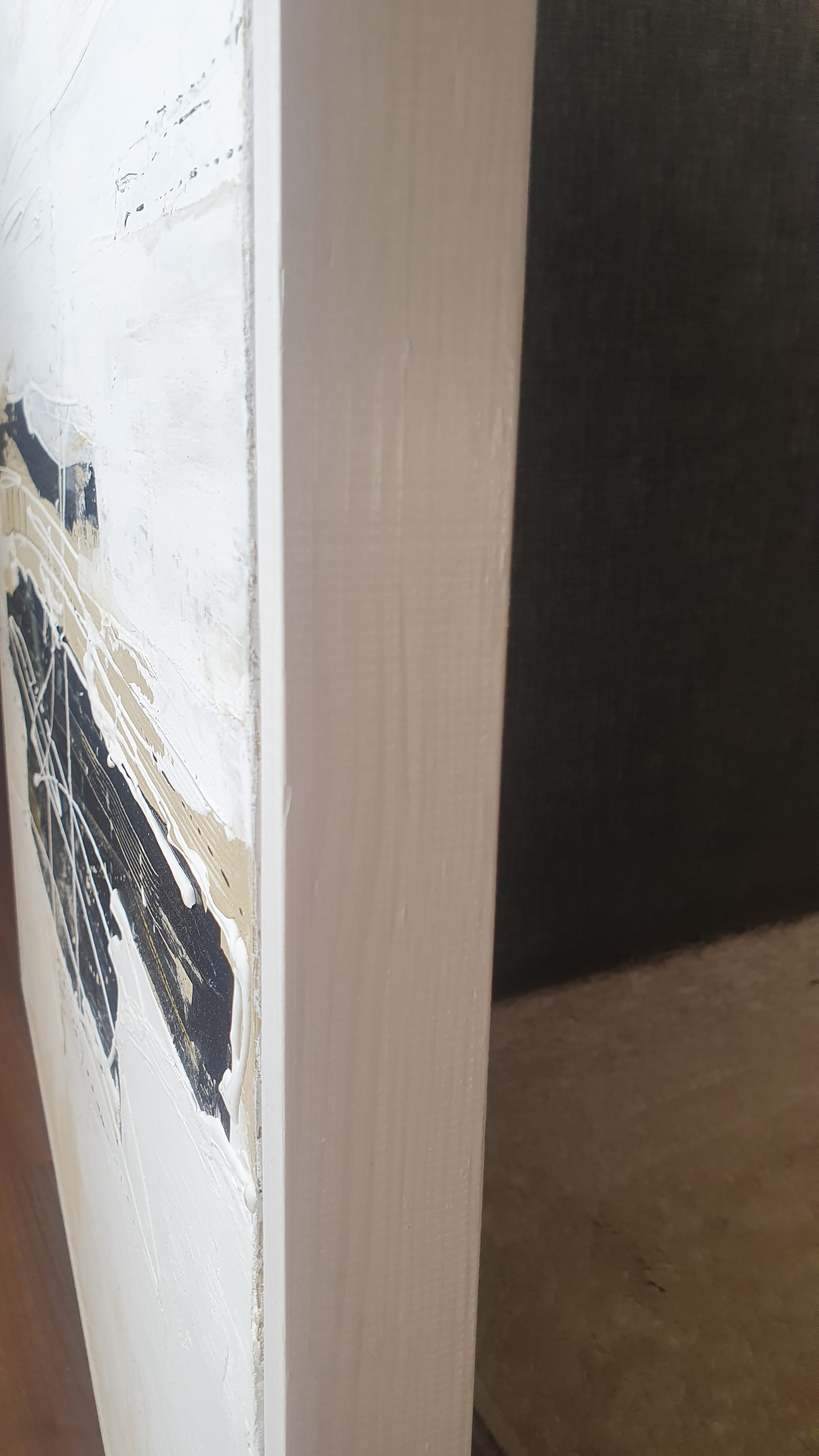 A painting with black and white paint on a white background.