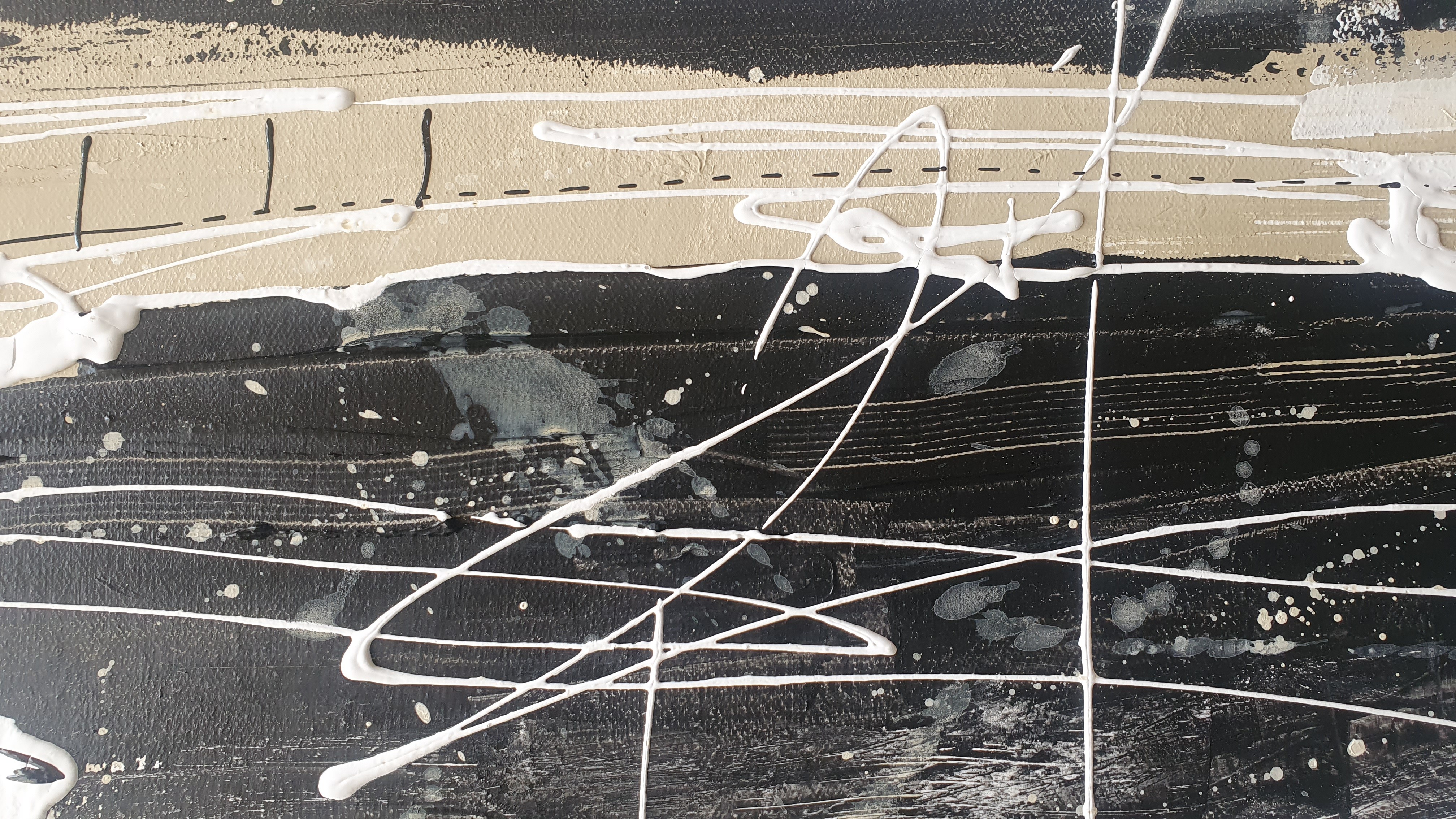 A painting with black and white paint on a white background.