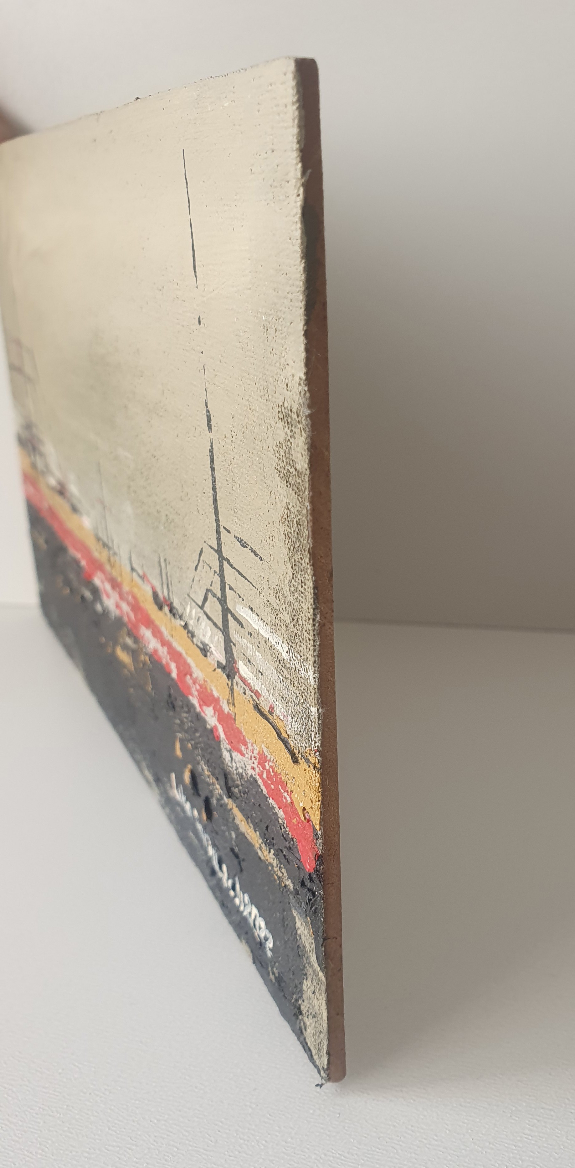 A painting of a boat on a canvas with red and black paint.