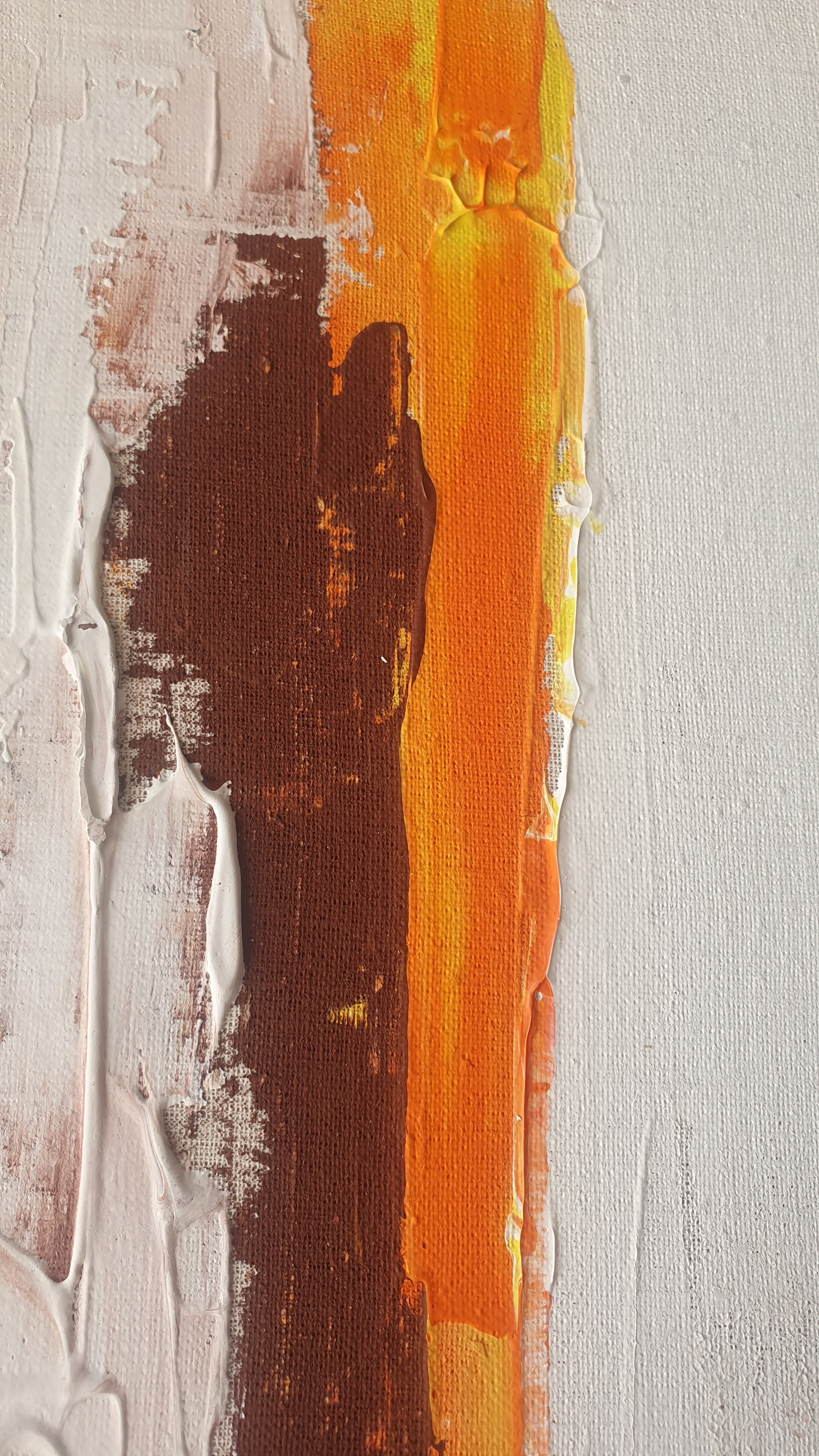 A close up of a painting on a white wall.