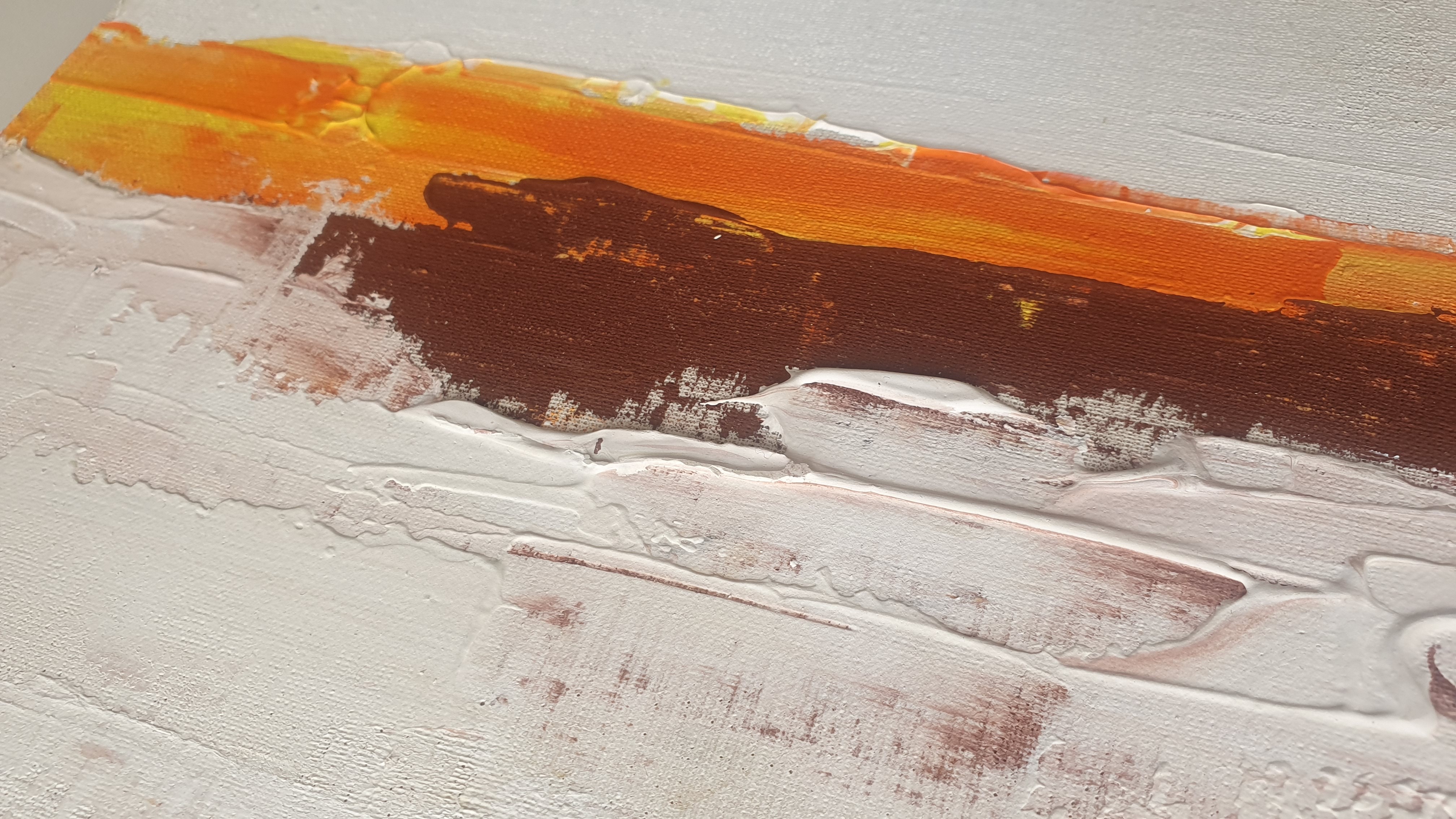 A close up of a painting on a white wall.
