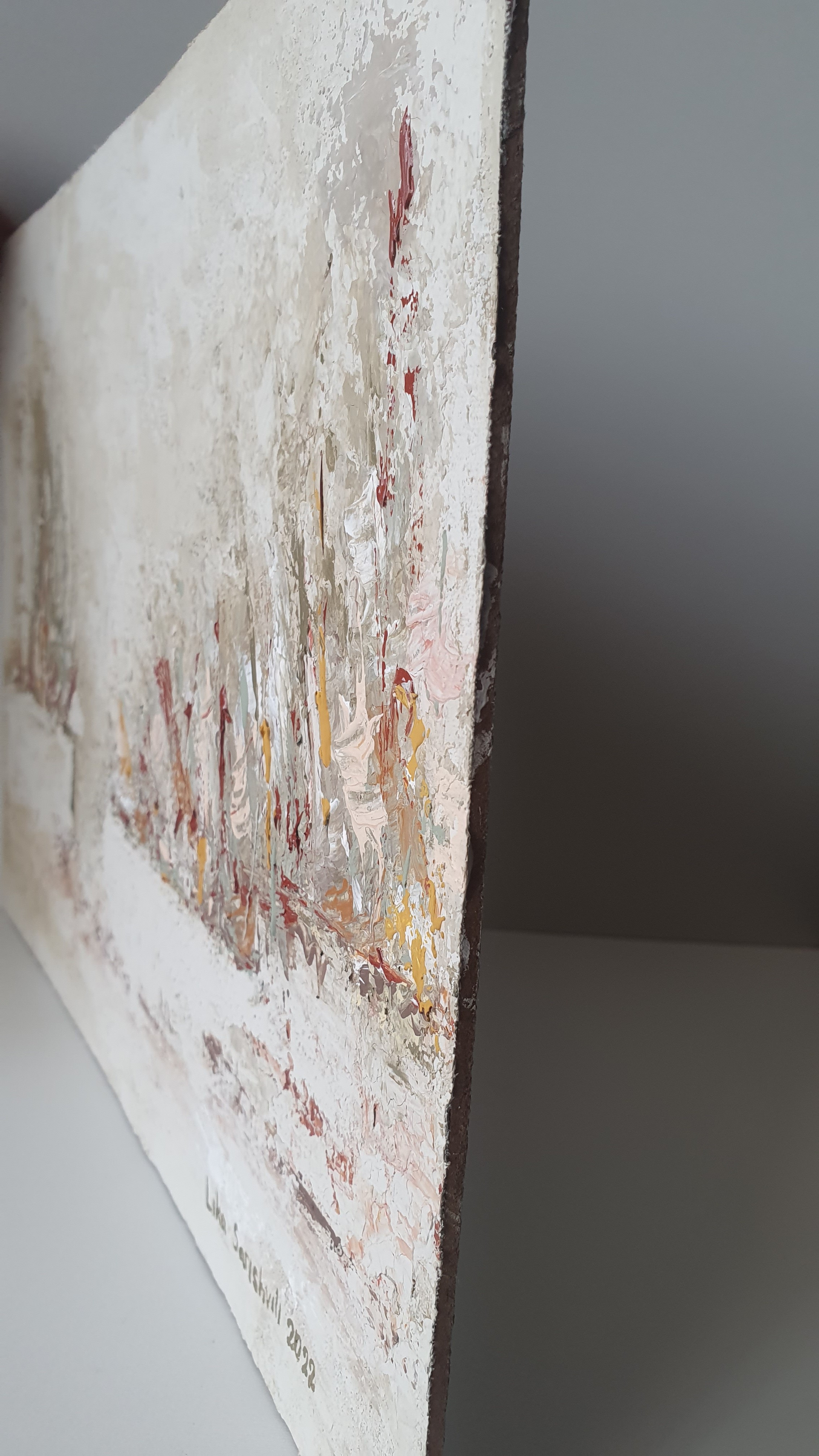 A close up of a painting on a wall. 