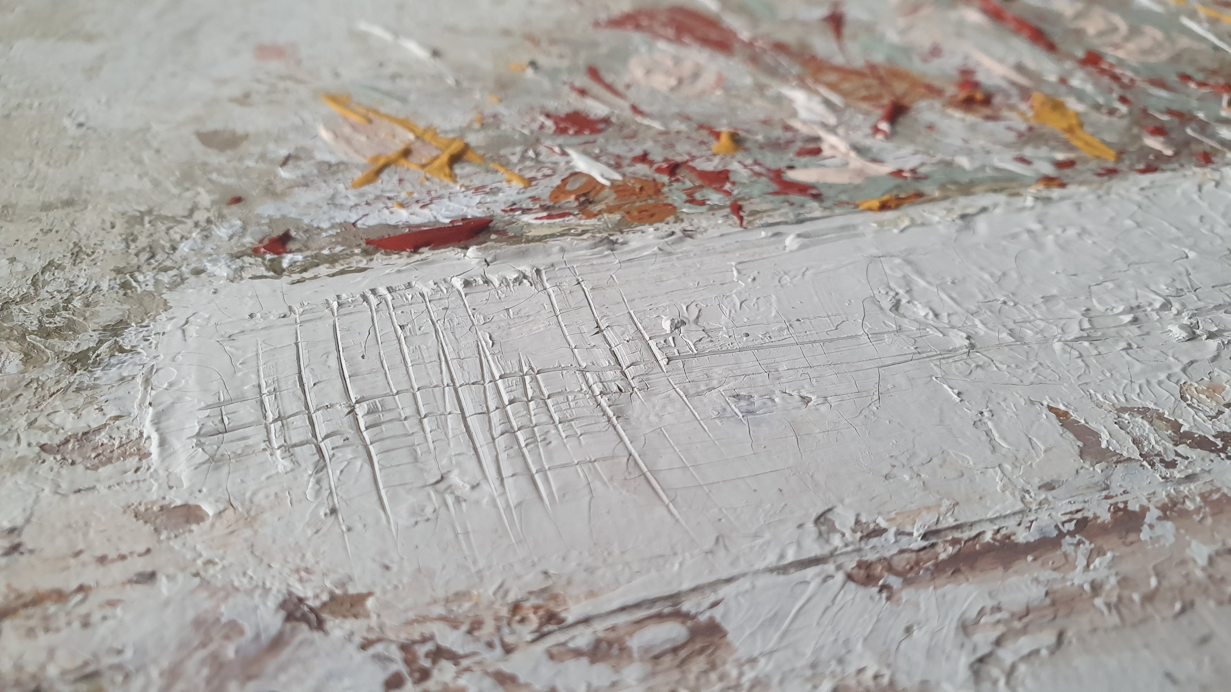 A close up of a painting on a wall. 