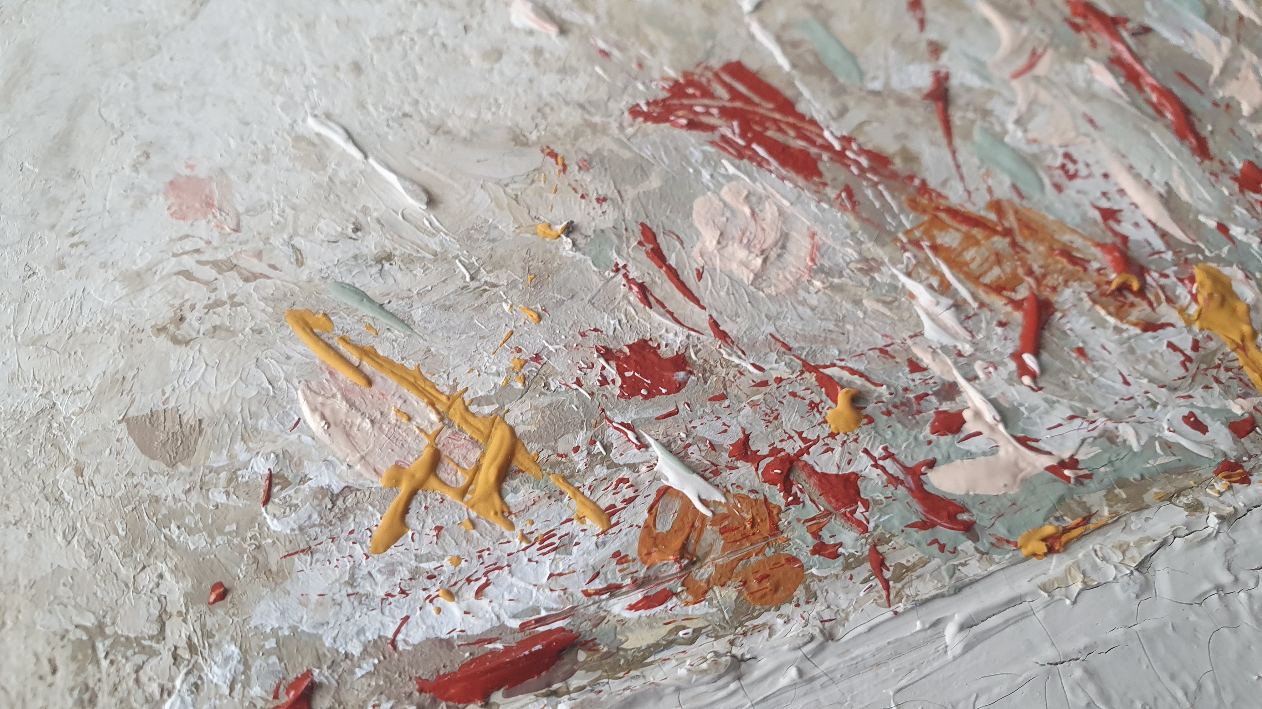 A close up of a painting on a wall. 