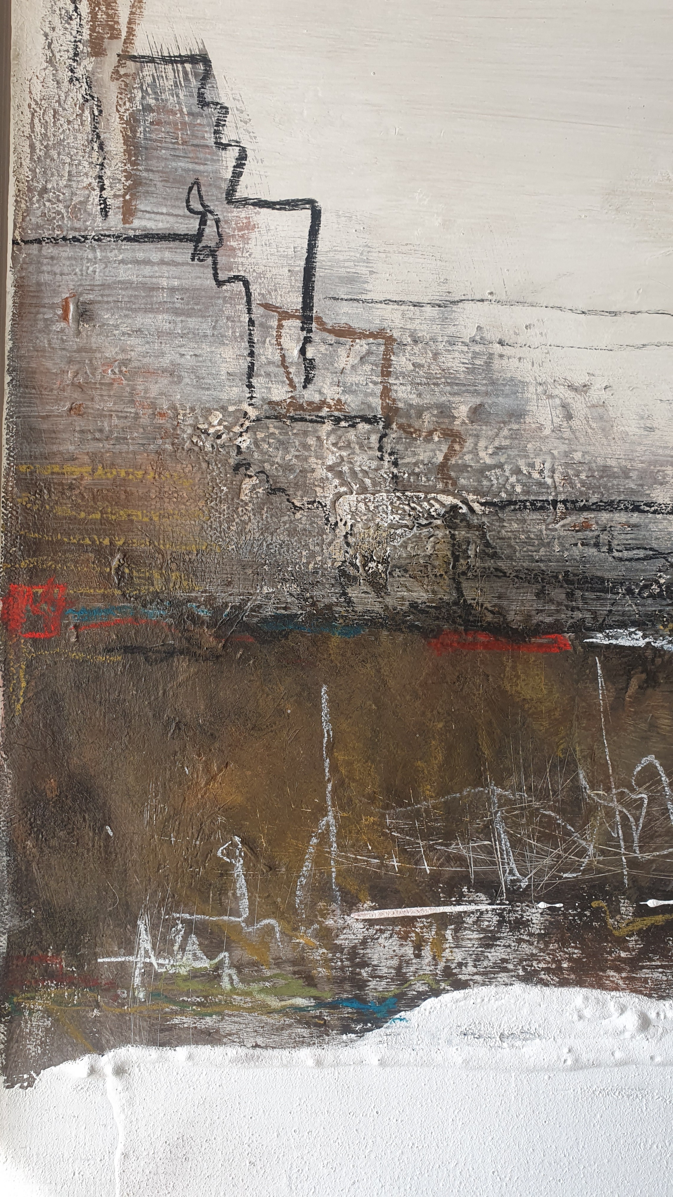 A painting of a cityscape with a white frame on a wall.