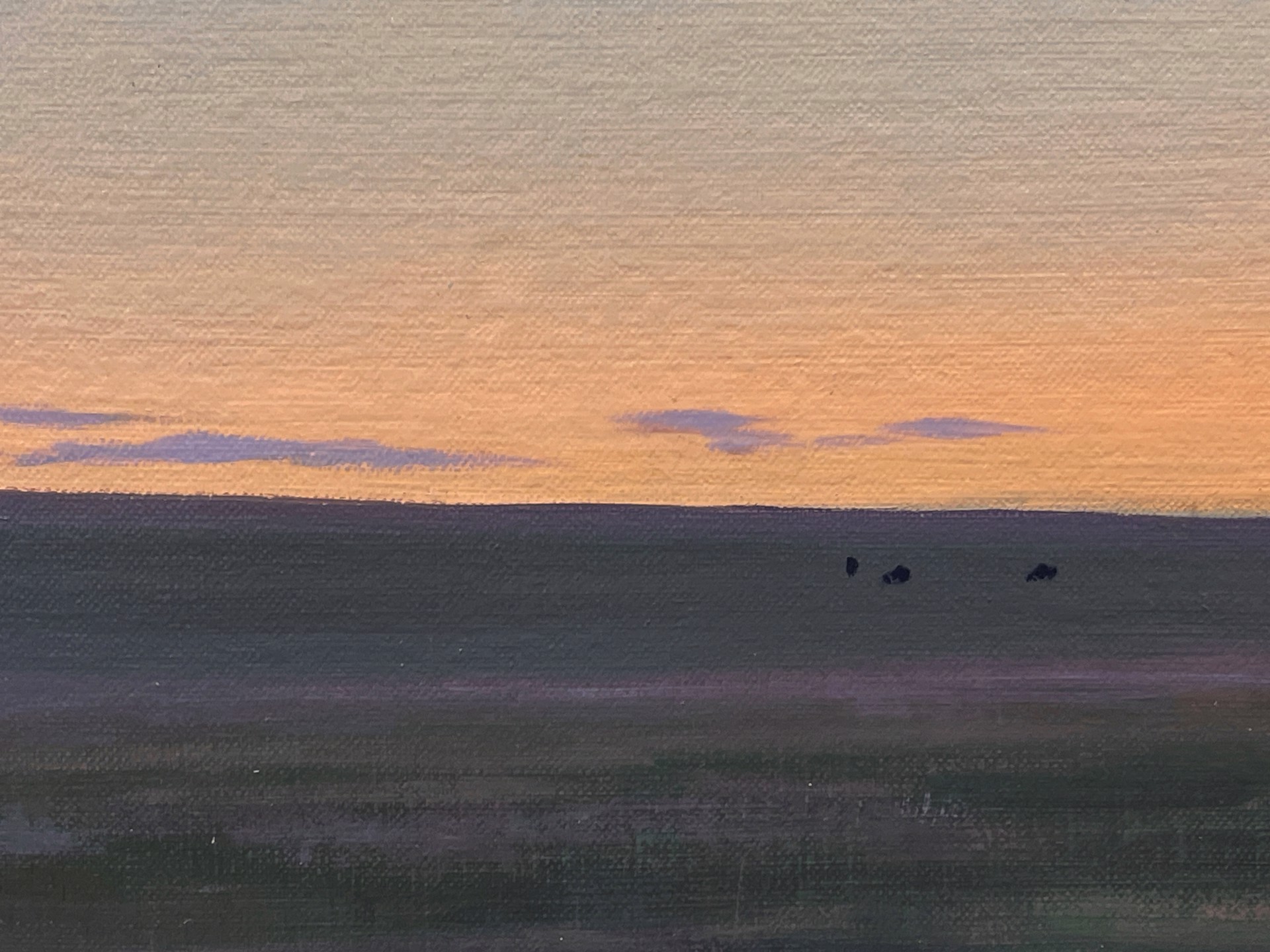 A painting of a herd of cattle grazing in a field at sunset.