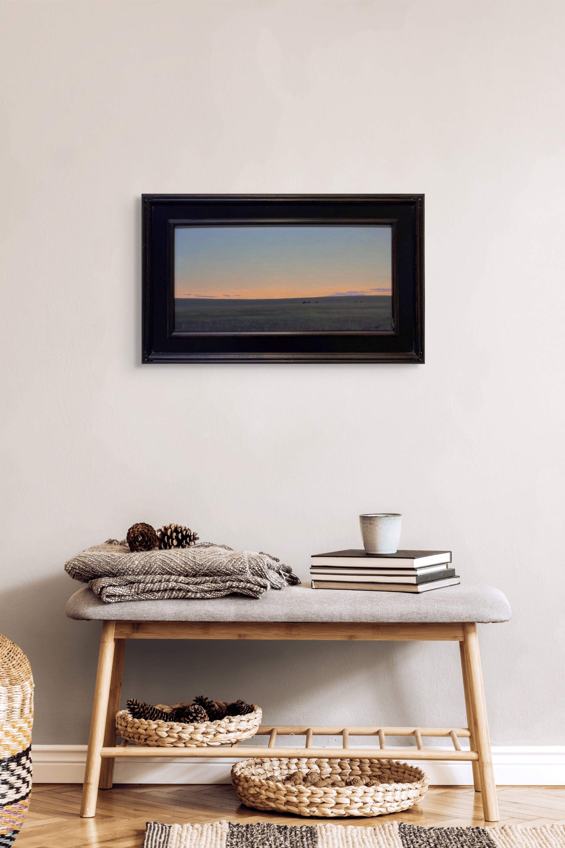 A painting of a herd of cattle grazing in a field at sunset.